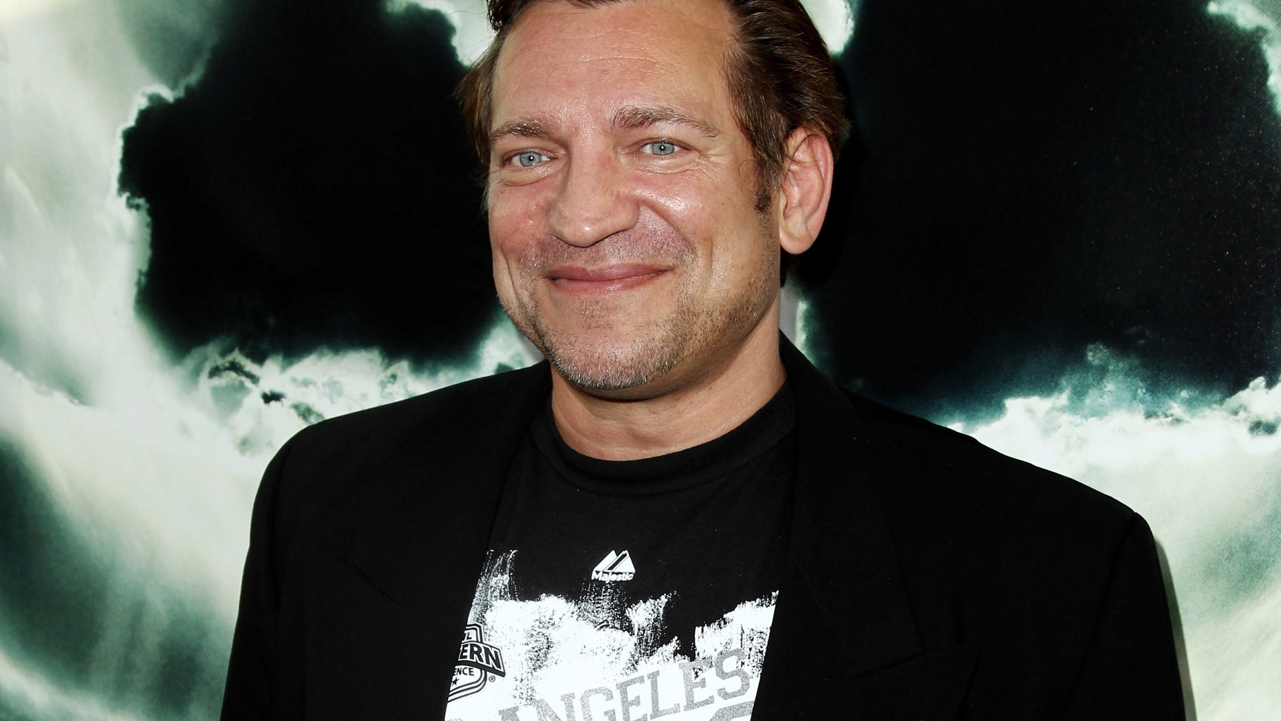 FILE - In this May 23, 2012 file photo, cast member Dimitri Diatchenko arrives at the premiere of "Chernobyl Diaries" in Los Angeles. Diatchenko is charged with killing his ex-girlfriend's pet rabbit, sending her grisly photos of its carcass, and threatening to do the same thing to her. Los Angeles County prosecutors charged Diatchenko of North Hollywood, on Tuesday, Dec. 9, 2014, with cruelty to an animal and making criminal threats. (Photo by Matt Sayles/Invision, File)