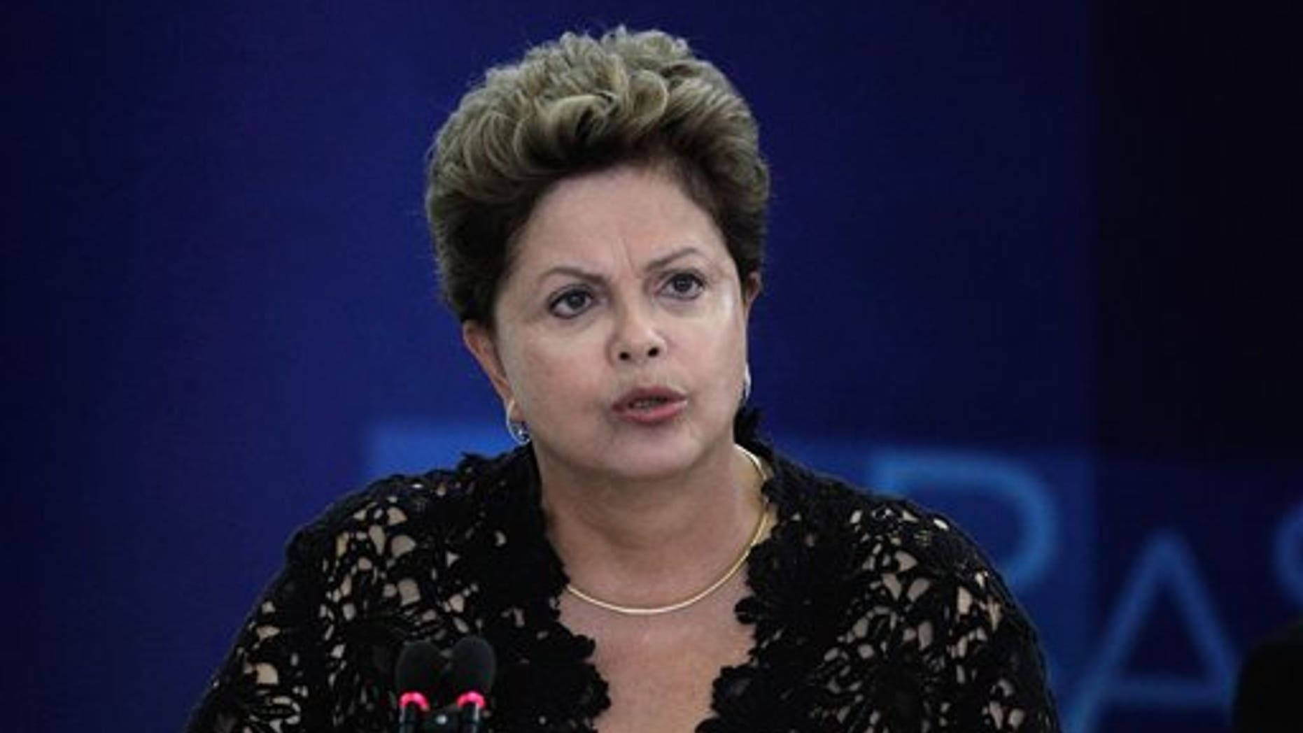 Brazil's President Dilma Rousseff speaks during a ceremony to present six new ministers to her cabinet, at the Planalto Presidential Palace, in Brasilia, Brazil, Monday, March 17, 2014. President Rousseff announced changes in her Cabinet with an eye on the October elections in which some of her former ministers will run for Congress and regional government posts. (AP Photo/Eraldo Peres)