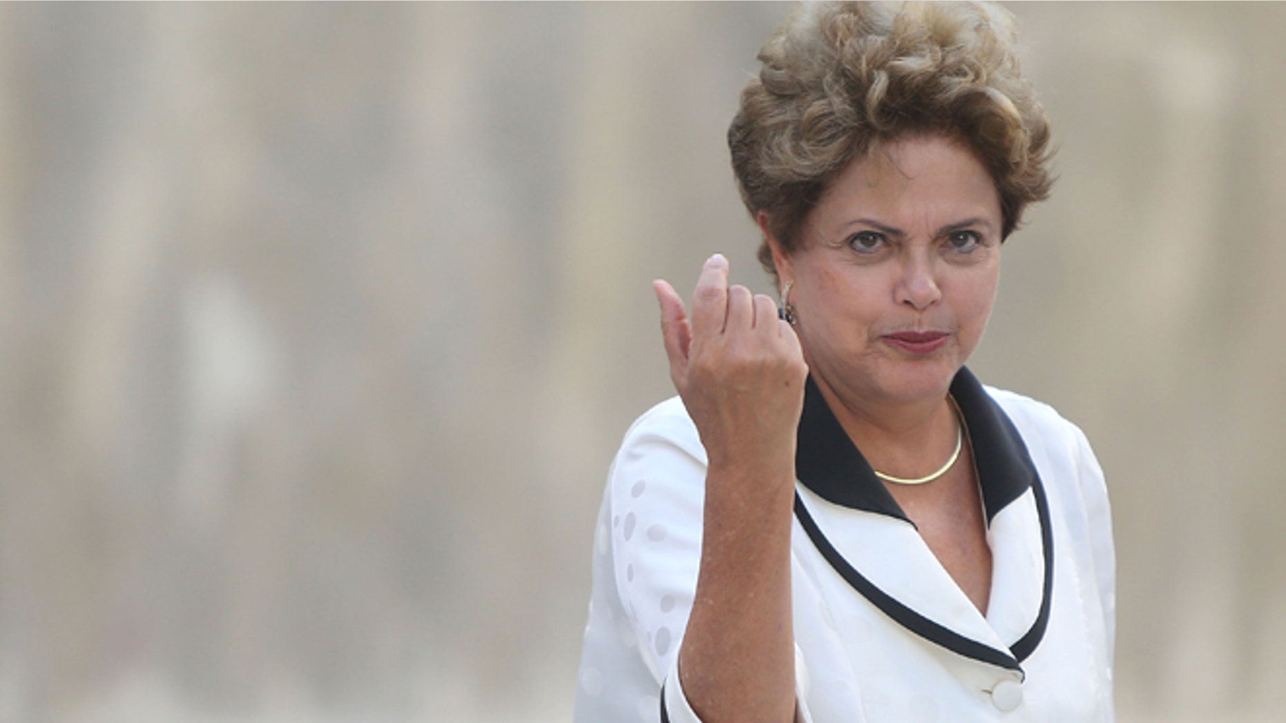 RIO DE JANEIRO, BRAZIL - MARCH 01: Brazilian President Dilma Rousseff prepares to inaugurate the new Rio 450 tunnel on the 450th anniversary of the founding of Rio de Janeiro on March 1, 2015 in Rio de Janeiro, Brazil. Rio marks its 450th anniversary today and is celebrating the event with a yearlong series of events including concerts, exhibitions, historical tours, soccer matches, fireworks displays and other activities. The ''Marvelous City'' was founded in 1565 by the Portuguese and was the seat of power of the Portuguese Empire in the 19th century before serving as the capital of the Brazilian Republic until 1960. The city is Brazil's most popular tourist destination and will host the Rio 2016 Olympic Games, the first to be held in South America, next year. (Photo by Mario Tama/Getty Images)