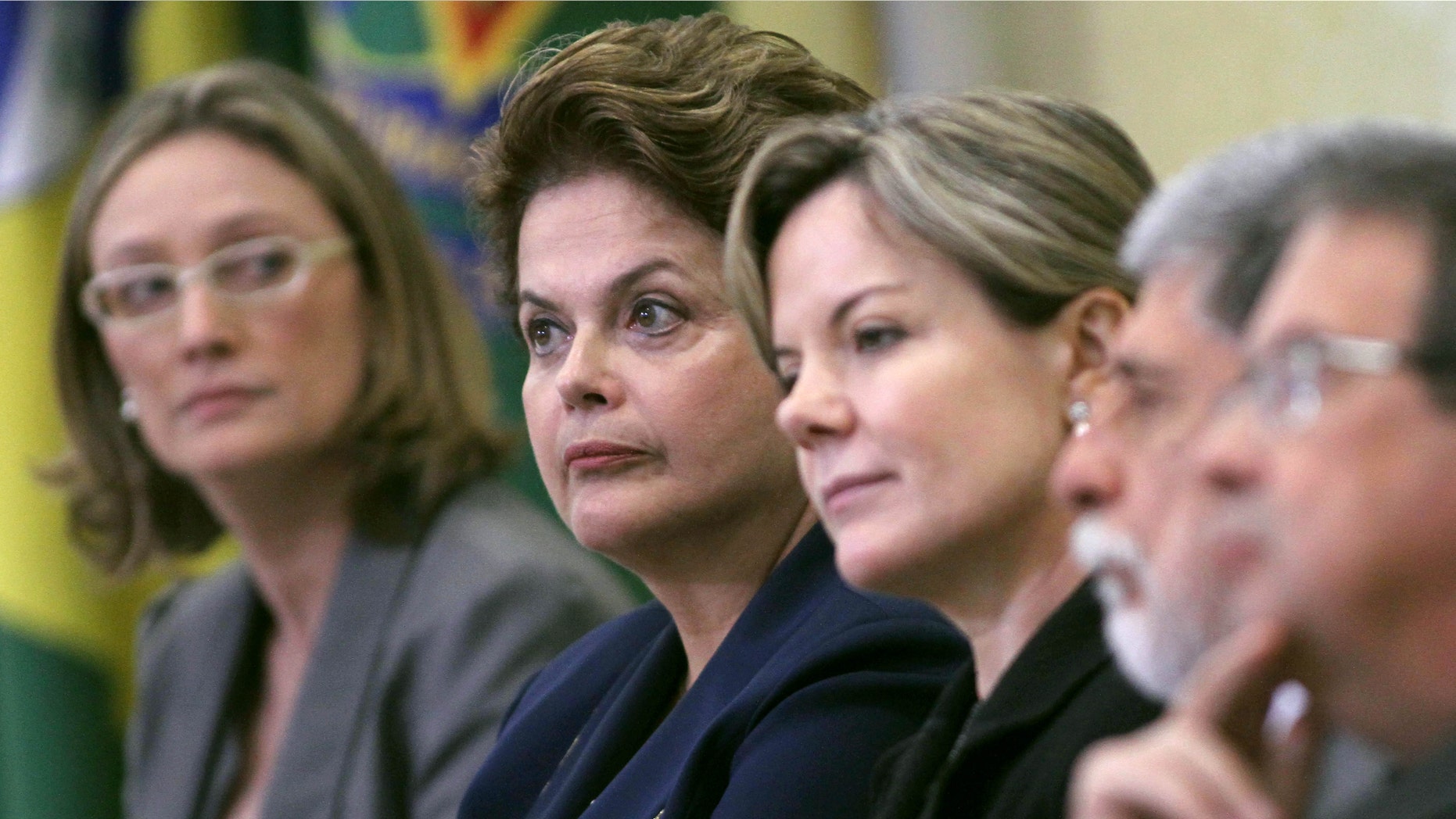 Brazil's President Dilma Rousseff, second from left, and her ministers attend a ceremony at which Rousseff signed a law establishing a truth commission in Planalto presidential palace in Brasilia, Brazil, Friday Nov. 18, 2011. (AP Photo/Eraldo Peres)
