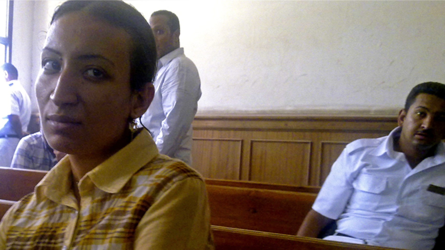 This Saturday, May 11, 2013 photo, provided by the lawyer of Dimyana Abdel-Nour, shows Abdel-Nour, 24, a Coptic Christian teacher, in a courtroom in the southern Egyptian city of Luxor, Egypt.