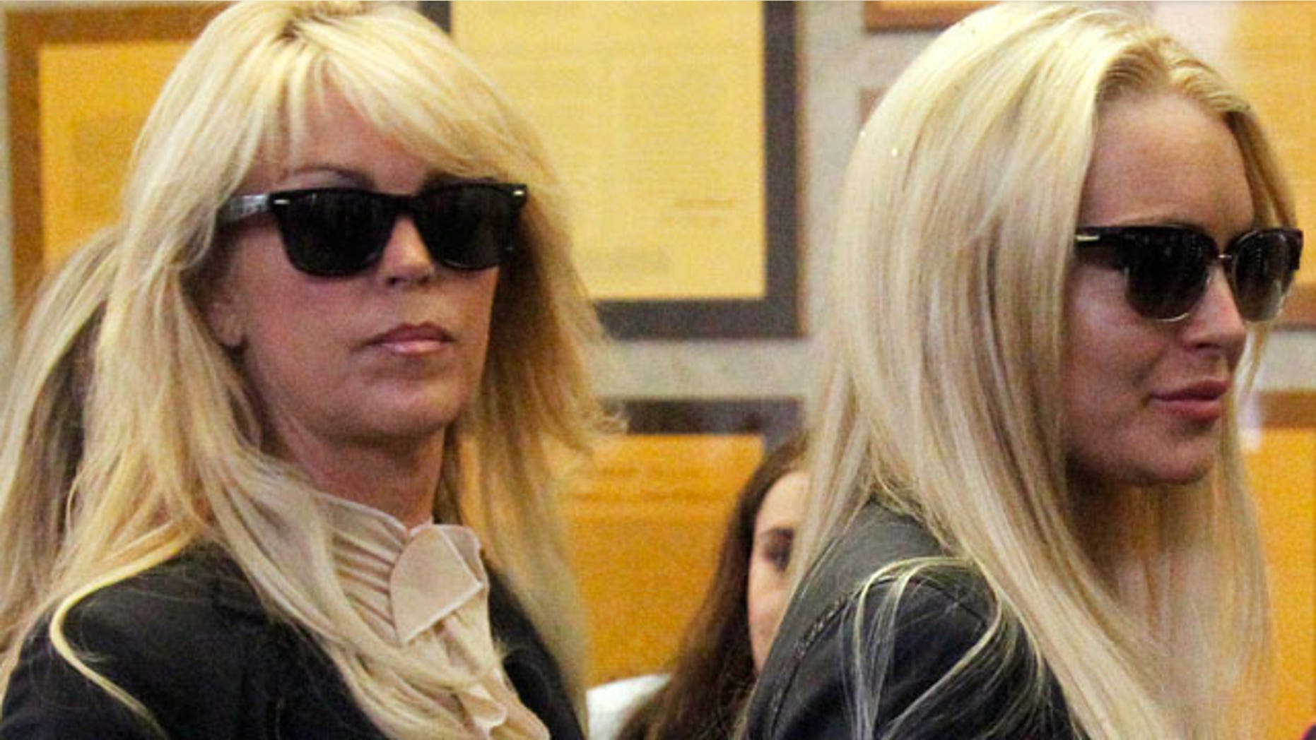 July 20: Actress Lindsay Lohan stands with her mother Dina Lohan.