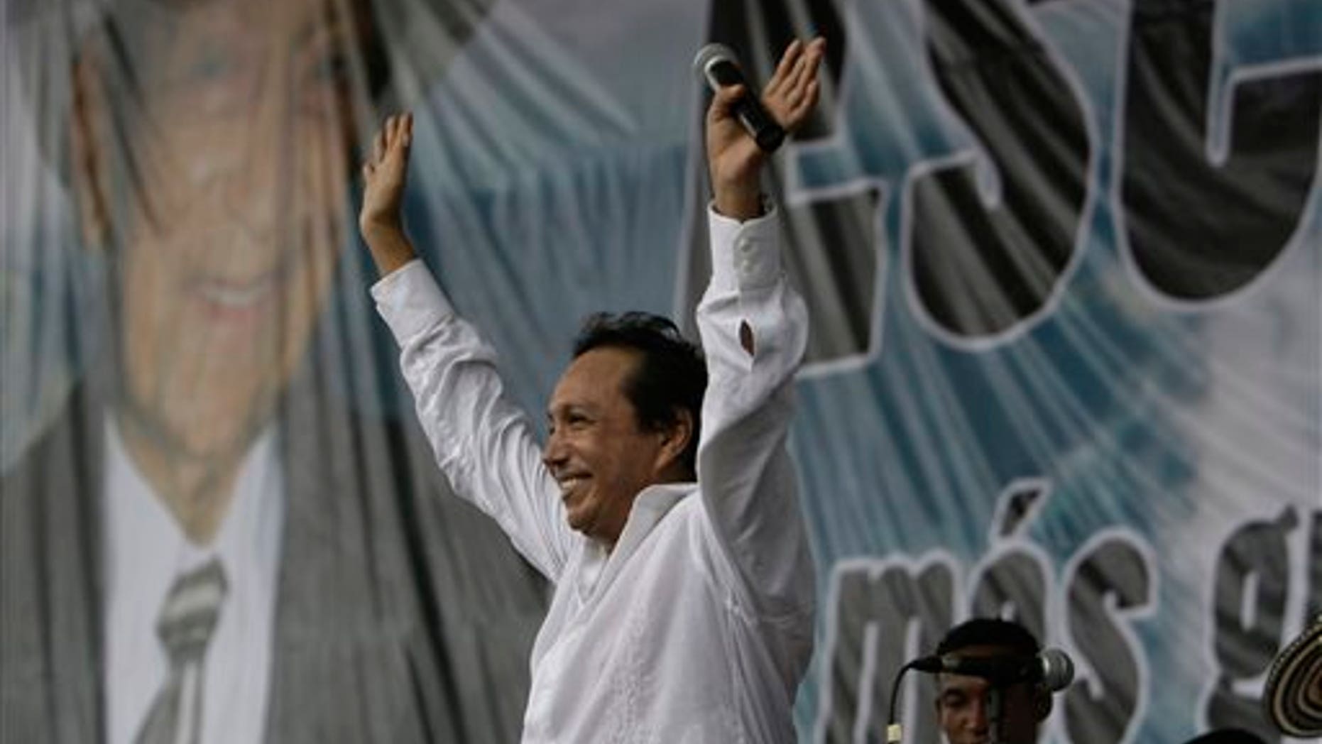 FILE - In this Friday, May 15, 2009, file photo, singer and composer Diomedes Diaz waves after singing in Colombia's northern state of Cesar. Diomedes Diaz, the best-known performer of Colombia's accordion-heavy vallenato music, died Sunday, Dec. 22, 2013, at age 56. (AP Photo/Ricardo Mazalan)