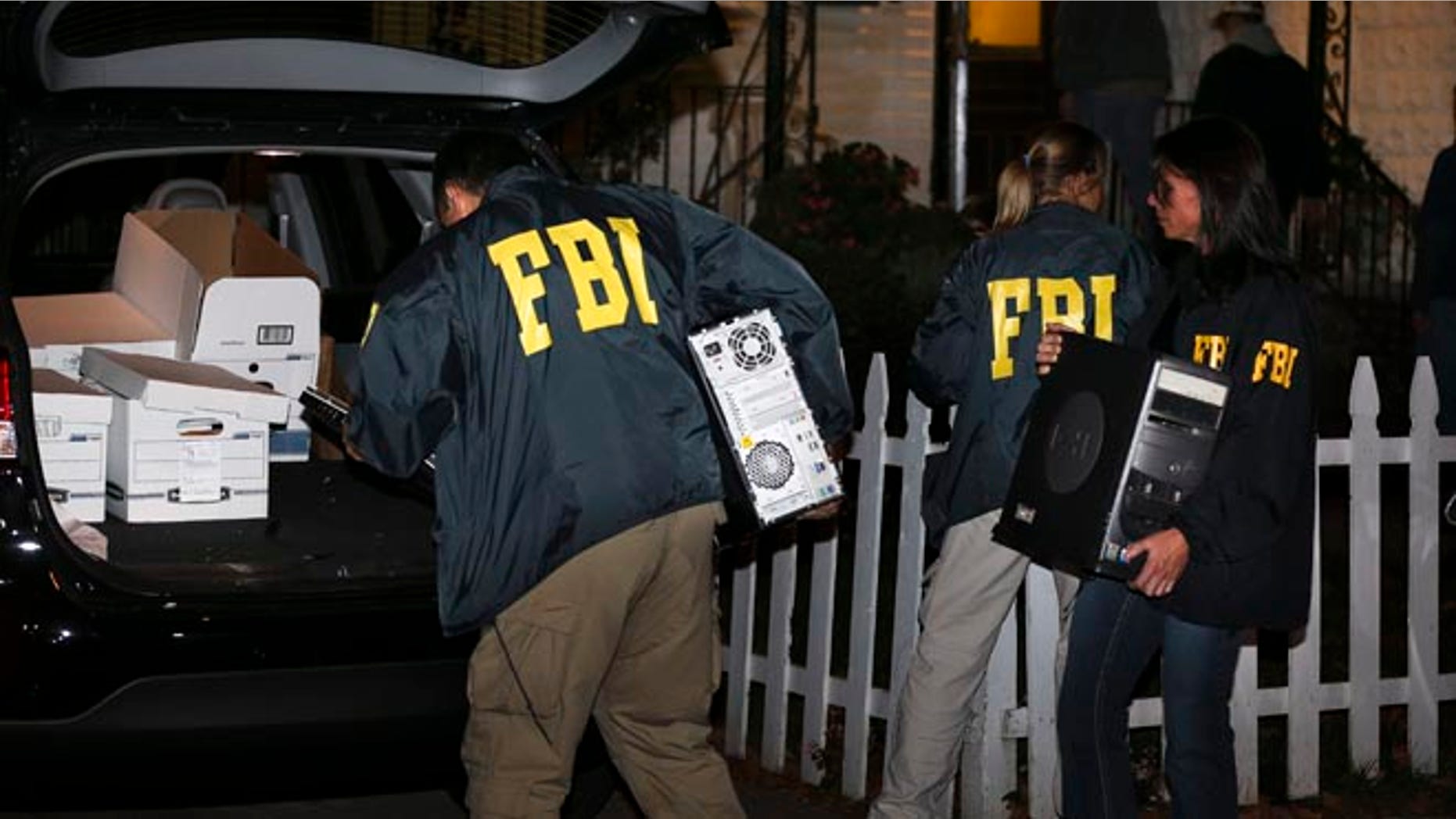 Oct. 10, 2013 FBI agents remove evidence from the Brooklyn residence of Rabbi Mendel Epstein during an investigation in New York.