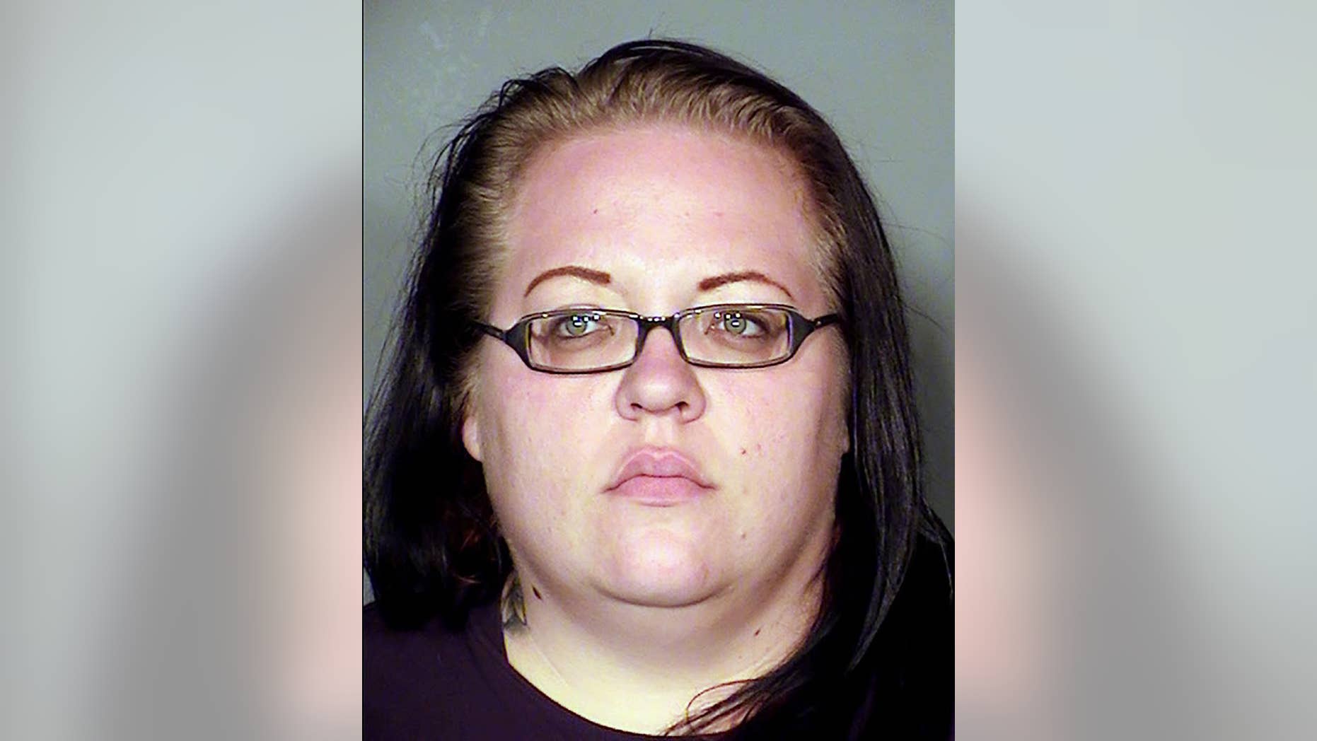 In this Monday, Feb. 23, 2015, booking photo provided Las Vegas Metropolitan Police Department shows suspect Jesse Vonstaden, 29, at the Clark County Detention Center in Las Vegas. Vonstaden faces felony charges including willful disregard for the safety of people and having dangerous or vicious dogs after police say four dogs she owns attacked two neighbors in a northeast Las Vegas neighborhood. Police say a 65-year-old woman was left with critical arm, leg and facial injuries, and a man suffered a severe hand injury. (AP Photo/Las Vegas Metropolitan Police Department)