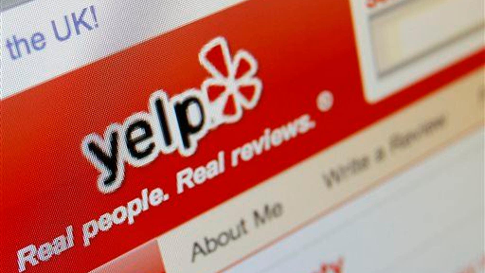 This March 17, 2010, file photo shows the Yelp website on a computer screen in Los Angeles.