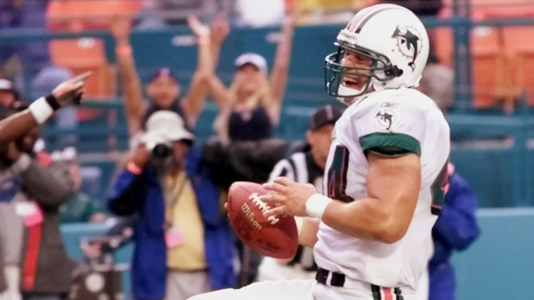 FILE - Miami Dolphins fullback Rob Konrad high-steps into the end zone as he scores against the Carolina Panthers in the second half in this Sunday, Nov. 4, 2001 file photo taken in Miami. (AP Photo/Wilfredo Lee, File)