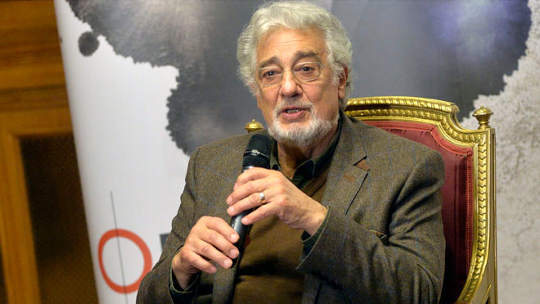 Spanish tenor Placido Domingo speaks during a press conference one day ahead of his performance at the Shakespeare gala as part of the Budapest Opera Ball in the Hungarian State Opera House in Budapest, Hungary, Friday, Feb. 5, 2016. (Zoltan Mathe/MTI via AP)