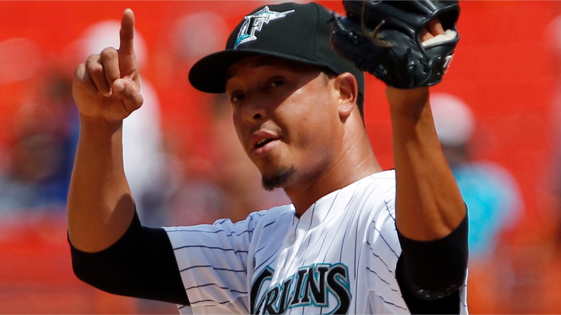 In this July 10, 2011, photo, Florida Marlins relief pitcher Juan Carlos Oviedo, at the time known as Leo Nunez, celebrates as the Marlins defeated the Houston Astros 5-4 in a baseball game in Miami. Oviedo says he has his U.S. visa, and will able to rejoin the Miami Marlins in August after serving a suspension from Major League Baseball. Oviedo was caught playing under the fake name of Leo Nunez and spent the offseason in the Dominican Republic clearing up his immigration status. (AP Photo/Wilfredo Lee)