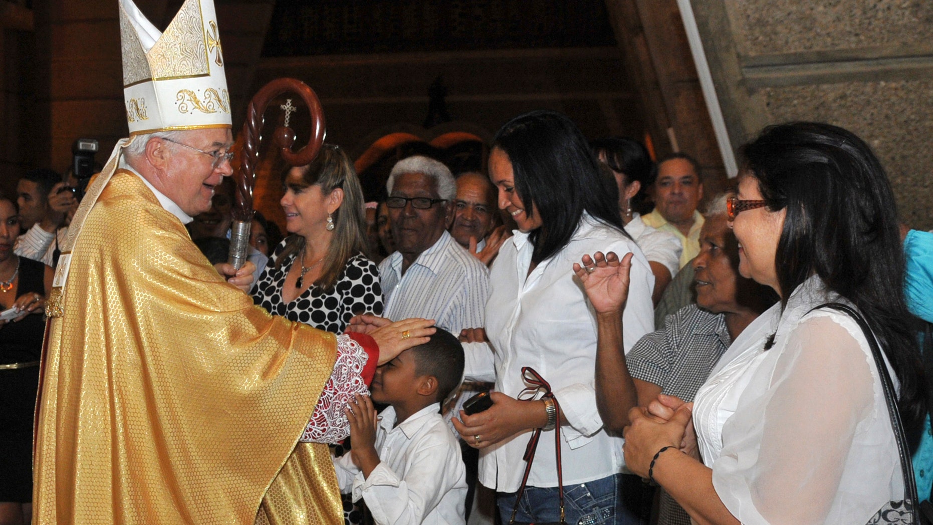 March 15, 2013 - FILE photo of Archbishop Josef Wesolowski, papal nuncio for the Dominican Republic, greeting people after a Mass in Santo Domingo, Dominican Republic. Wesolowski has been convicted by a church tribunal of sex abuse and has been defrocked.
