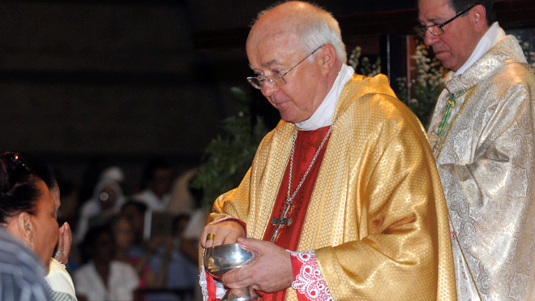 In this March 15, 2013, Archbishop Josef Wesolowski leads a Mass in Santo Domingo, Dominican Republic.