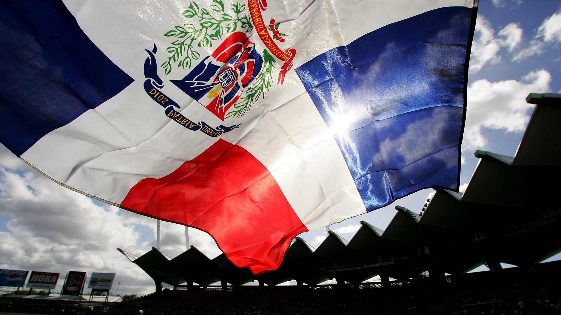 SAN JUAN, PUERTO RICO - MARCH 13: A fan flies the Dominican Republic flag during the game against Cuba during Round 2 of the World Baseball Classic on March 13, 2006 at Hiram Bithorn Stadium in San Juan, Puerto Rico. (Photo by Al Bello/Getty Images)