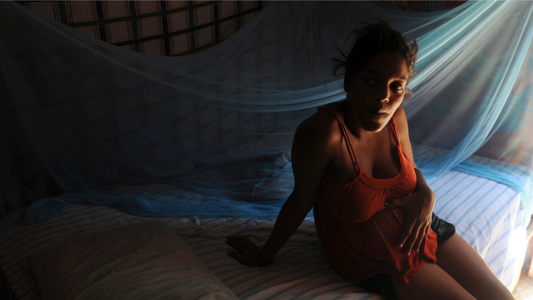 A 6-months pregnant Marlene Herrera, 22, rests on her bed after being discharged from a hospital where she was treated of cholera, in the La Cienega slum in Santo Domingo, Dominican Republic, Tuesday May 17, 2011. A wave of new cholera cases, with two deaths in recent days, has prompted the Dominican health authorities to declare a state of alert in 17 neighborhoods in the capital. The disease had not been detected in the country until after the outbreak in neighboring Haiti in October 2010 when fourteen people died and 750 were infected. (AP Photo/Manuel Diaz)