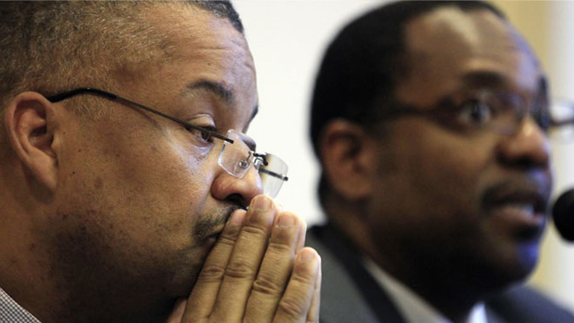 May 23, 2012: Newark Councilman Donald Payne Jr., left, son of the late New Jersey Rep. Donald Payne, listens as fellow Newark Councilman Ron Rice addresses a gathering in West Orange, N.J.