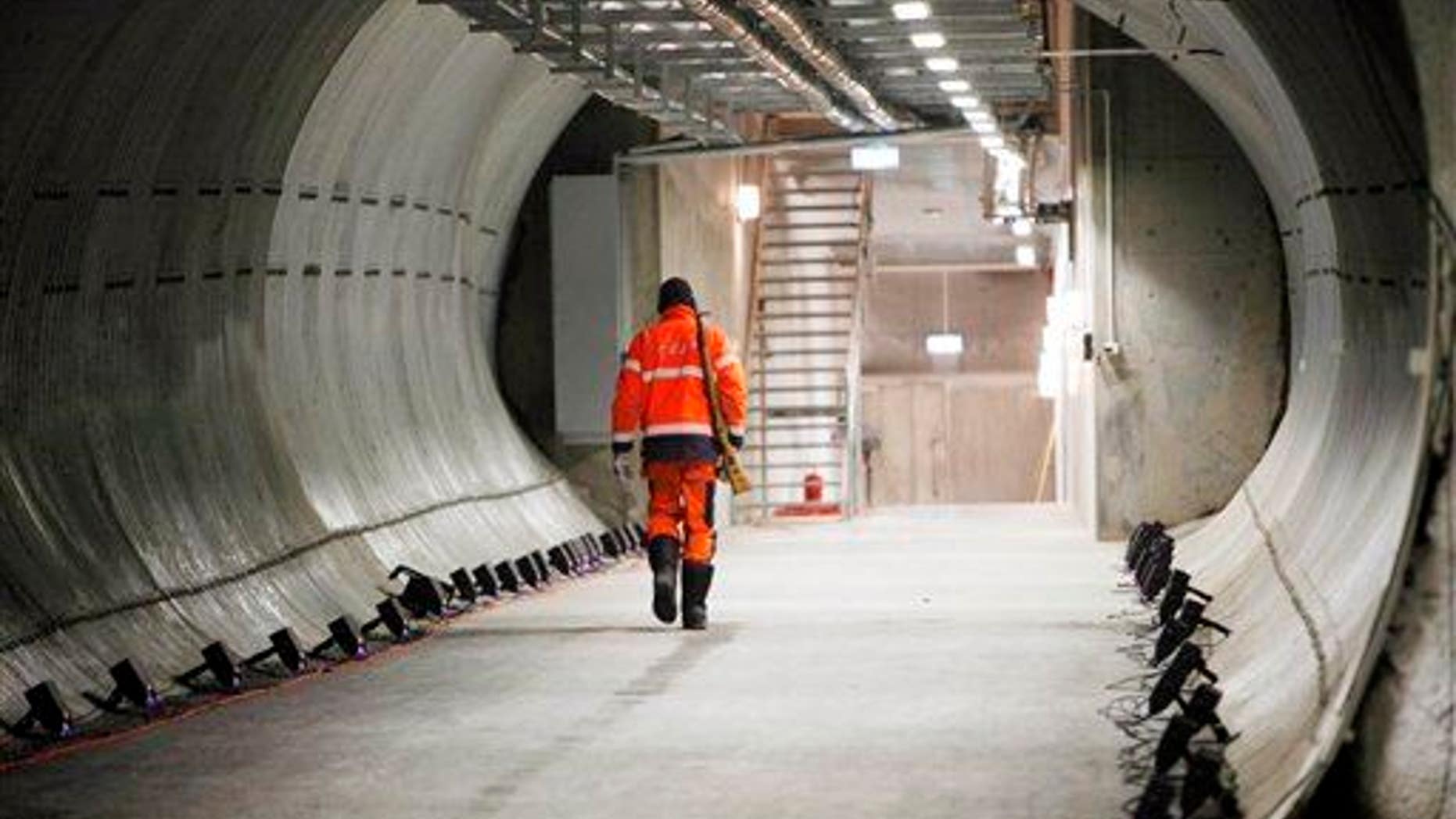 An armed guard walks through the Svalbard Global Seed Vault Monday, Feb. 25, 2008 in Longyearbyen, Norway.