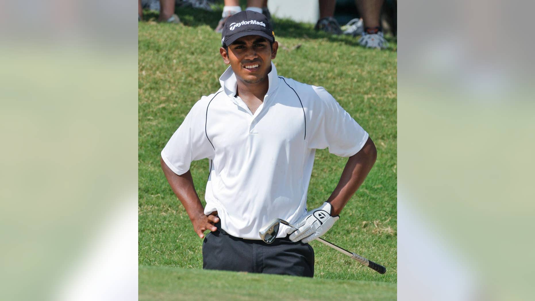 FILE - In this Aug. 20, 2009, file photo, Bhavik Patel, of Bakersfield, Calif., watches his shot from a bunker on the eighth green against Byeong-Hun An during the semifinal round of the U.S. Amateur Golf Championship in Tulsa, Okla. Patel has been suspended one year for violating the PGA Tour's anti-doping policy, making him the second player to be suspended since golf began its drug testing program in June 2008. The tour said the suspension would be retroactive to Oct. 7, 2014. That means Patel would not be eligible to play until Web.com Q-school next fall. Patel has never played a PGA Tour event. (AP Photo/Sue Ogrocki, File)