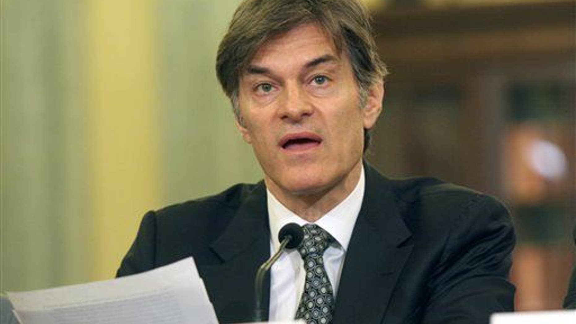 Dr. Mehmet Oz testifies on Capitol Hill in Washington, June 17, 2014, before the Senate subcommittee on Consumer Protection, Product Safety, and Insurance.