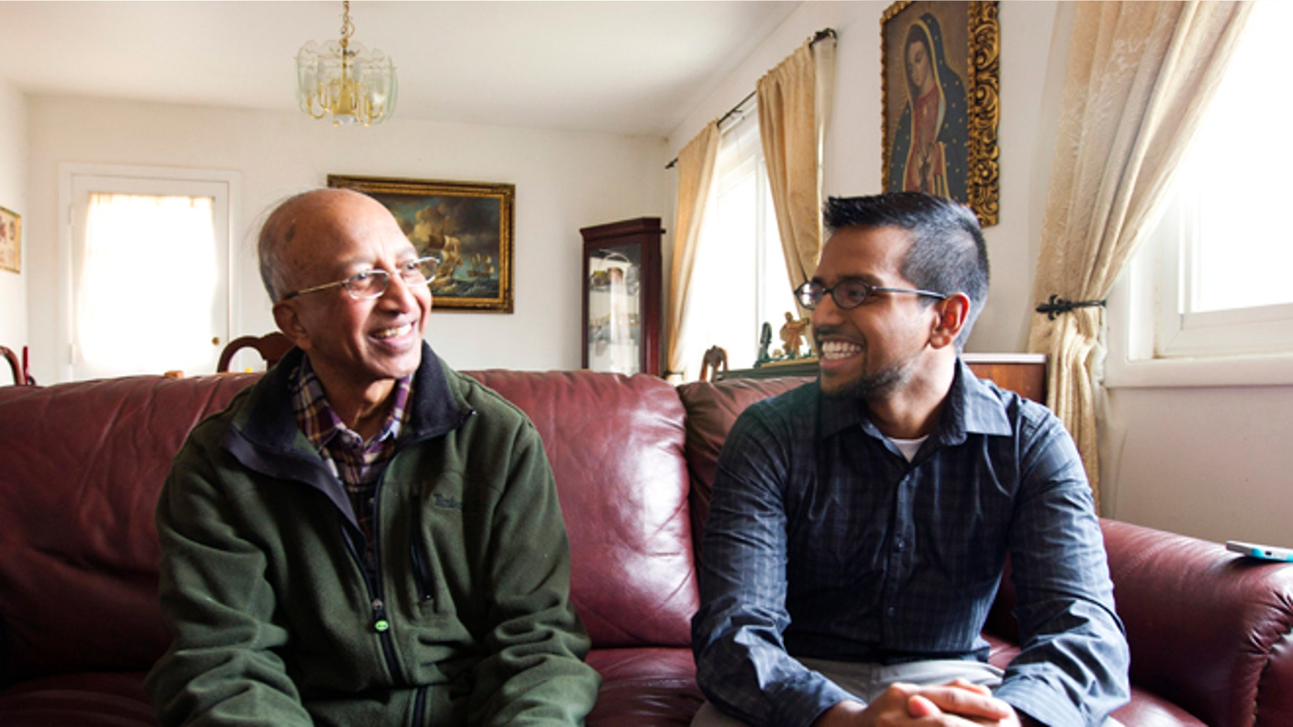 FILE: Jan. 17, 2014: Yves Gomes, a college student whose parents were deported, right, talks to a great uncle in Silver Spring, Md.