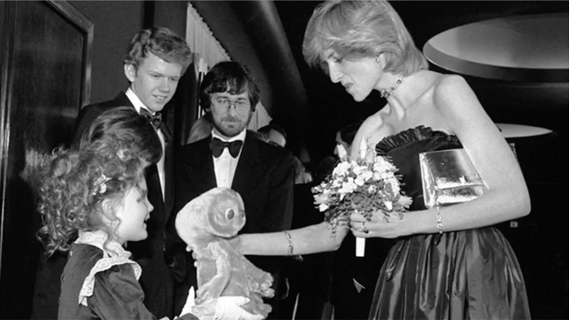 Drew Barrymore, 7, gives Princess Diana a stuffed animal.