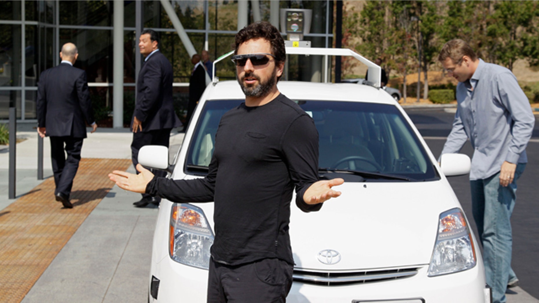 Sept. 25, 2012: Google co-founder Sergey Brin gestures after riding in a driverless car with California Gov. Jerry Brown, left, and state Sen. Alex Padilla, second from left.