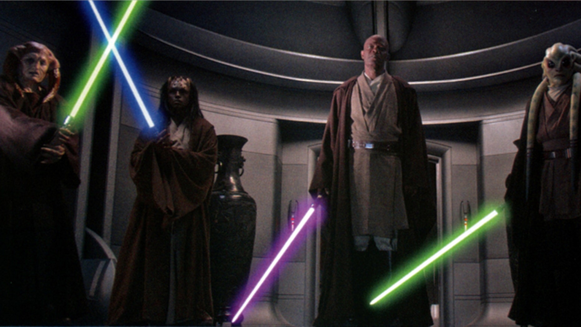 Saesee Tiin, Agen Kolar, Mace Windu, and Kit Fisto ignite their lightsabers to arrest Supreme Chancellor Palpatine in Star Wars Episode III: Revenge of the Sith.