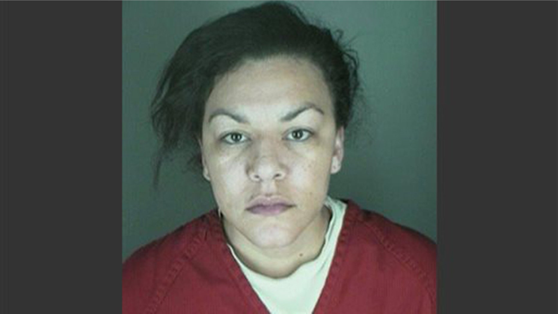 This undated booking photo provided by the Longmont Police Department shows Dynel Lane, 34, who is accused of stabbing a pregnant woman in the stomach and removing her baby, while the expectant mother visited her home to buy baby clothes advertised on Craigslist authorities said.