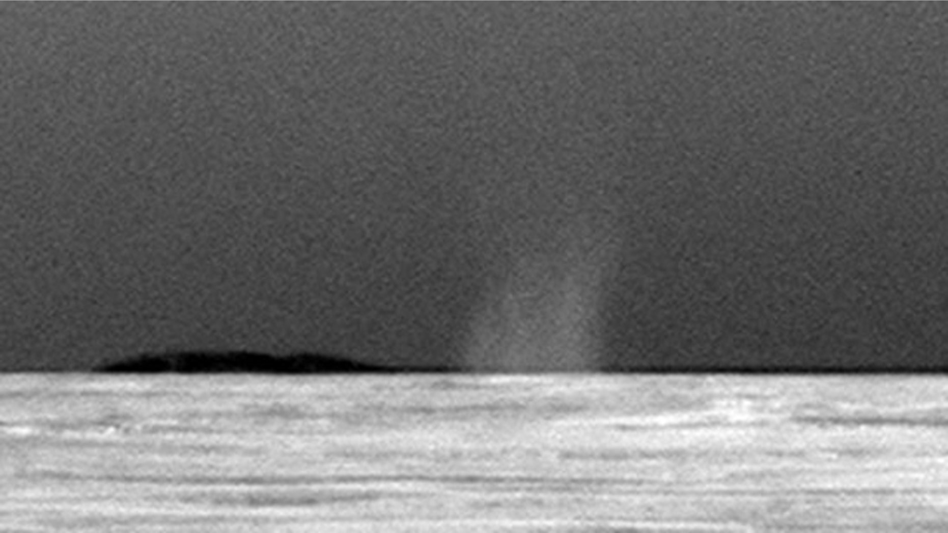 This photo taken July 15, 2010 shows the first dust devil observed by NASA's Mars Exploration Rover Opportunity in the rover's six-and-a-half years on Mars.
