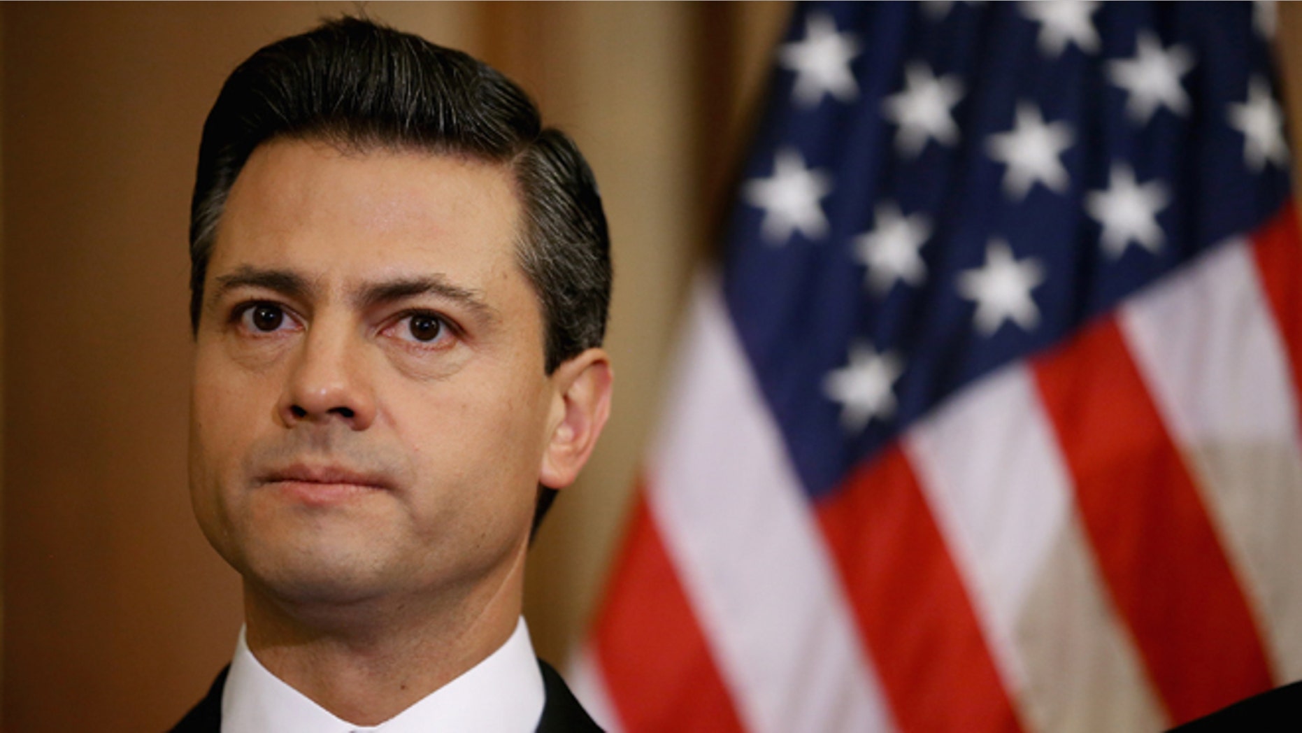 WASHINGTON, DC - NOVEMBER 27: Mexican President-Elect Enrique Pena Nieto delivers brief remarks after meeting with Democratic members of the House in the Rayburn Room at the U.S. Capitol November 27, 2012 in Washington, DC. Nieto, of Mexico's Institutional Revolutionary Party, will also visit the White House and meet with President Barack Obama today, days before he takes office on December 1. (Photo by Chip Somodevilla/Getty Images)