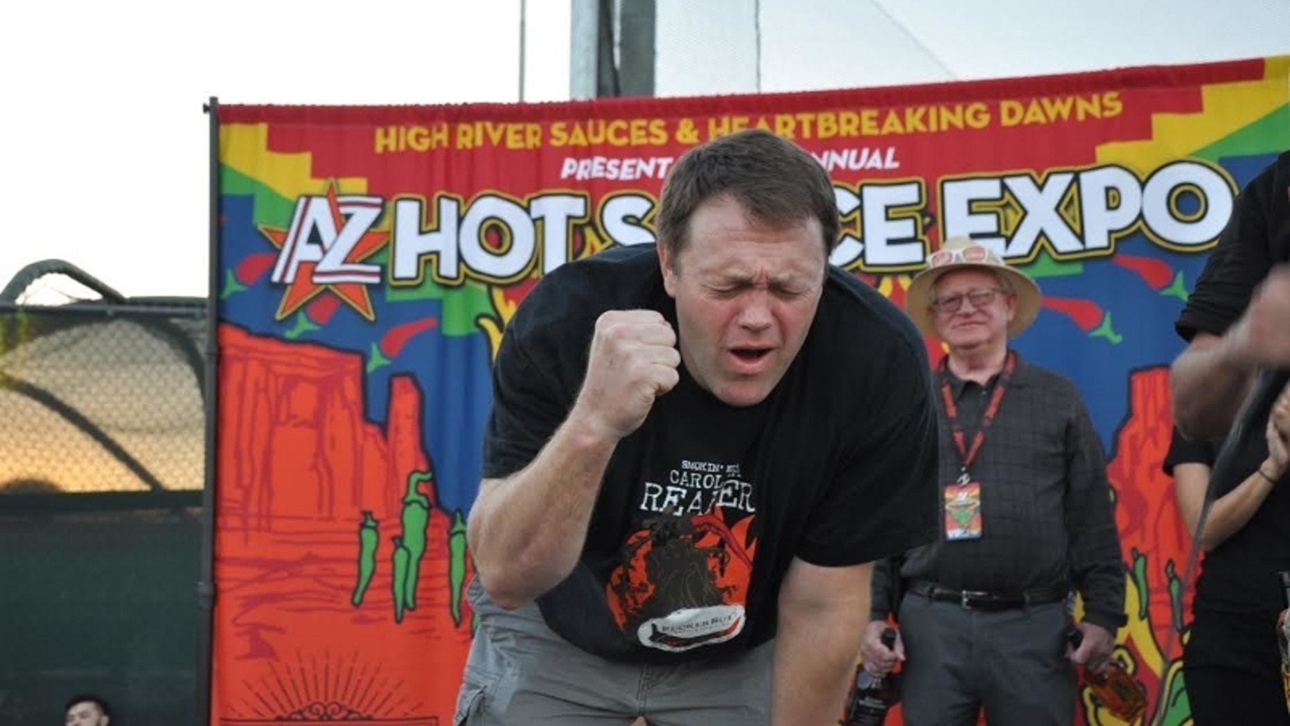 Greg Foster of Irvin, Calif. feels the burn after consuming 120 grams of Carolina Reaper peppers.