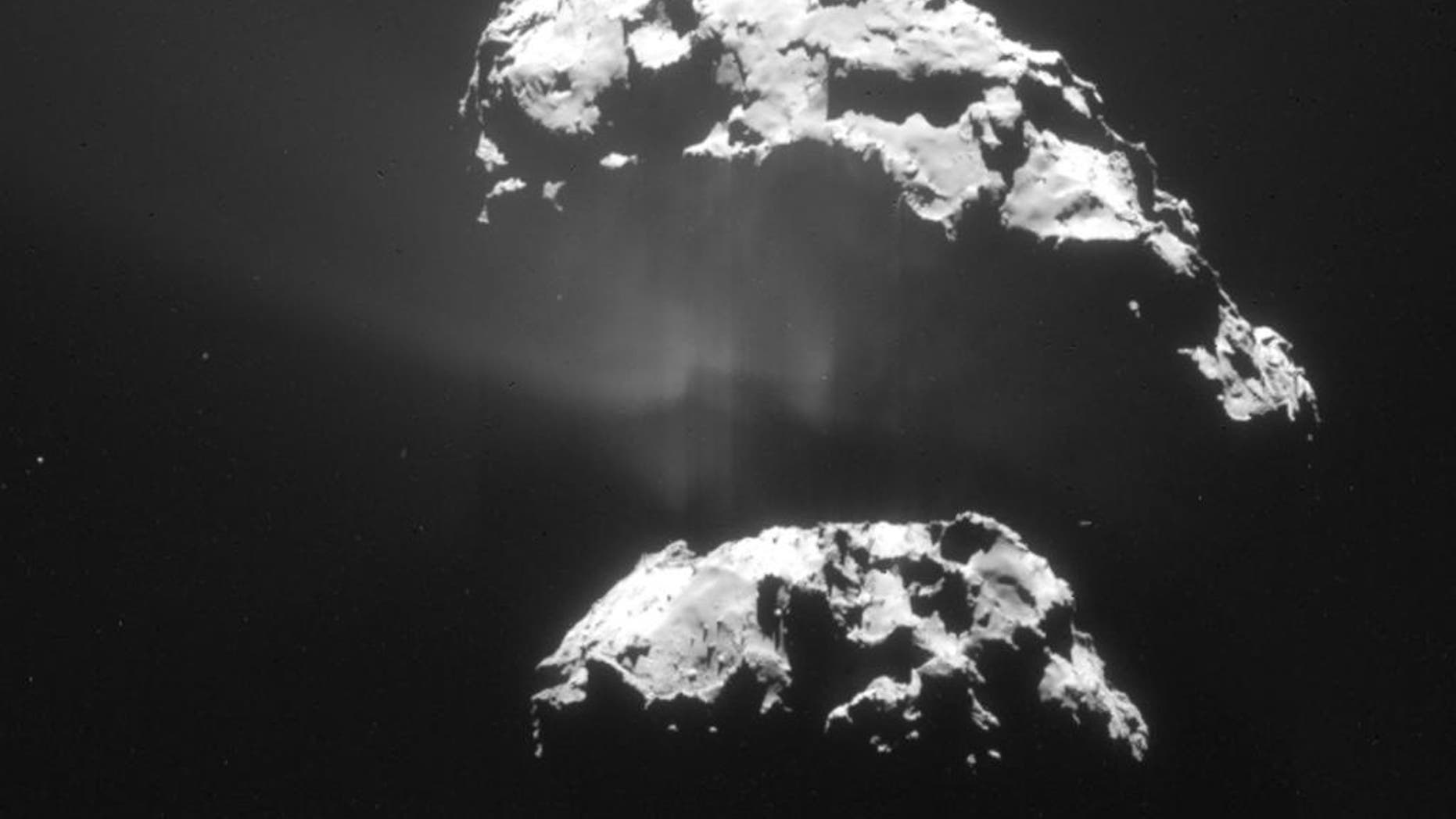 The Feb. 9, 2015 photo released by the European Space Agency ESA on Friday, Feb. 13, 2015 shows an image of the comet 67P/Churyumov-Gerasimenko taken by the Navcam camera of the Rosetta orbiter from a distance of 105km. The European Space Agency's Rosetta space probe has swooped in for a close look at the comet. Rosetta has been flying alongside the comet 67P/Churyumov-Gerasimenko and passed just 6 kilometers (less than 4 miles) above the comet’s surface on Saturday, Feb. 14, 2015. (AP Photo/ESA/Rosetta/Navcam)