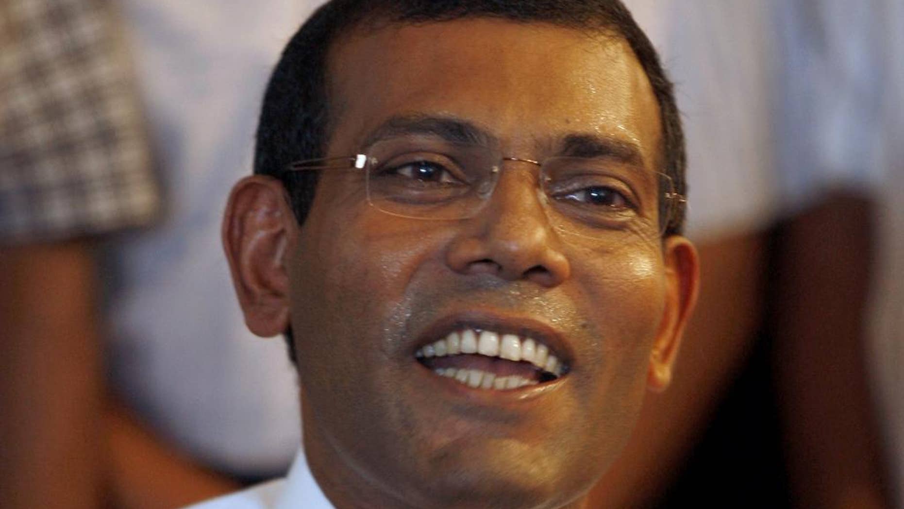 FILE - In this Sept. 8, 2013 file photo, Maldives’ first democratically elected President Mohamed Nasheed addresses the media at his residence in Male, Maldives. The United Nations' human rights chief is voicing concern over the "rushed" trial that led to a terrorism conviction and 13-year jail term for the Maldives' former president. U.N. high commissioner for human rights Zeid Raad al-Hussein said Wednesday, March 18, 2015 "flagrant irregularities" in the case against Nasheed could be rectified during the appeals process. (AP Photo/Sinan Hussain, File)
