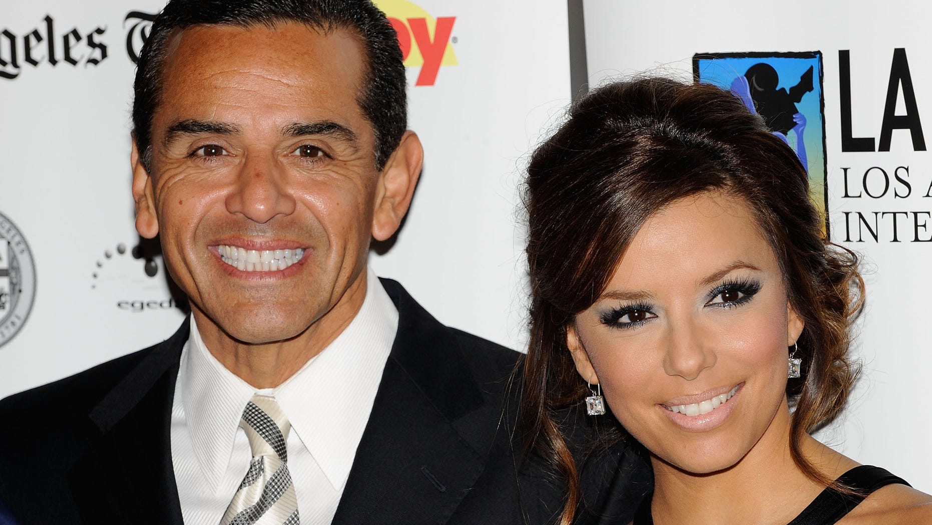 LOS ANGELES, CA - OCTOBER 11: Los Angeles Mayer Antonio Villaraigosa (L) and actress Eva Longoria Parker arrive at the 13th Annual Los Angeles Latino Film Festival Opening Night Gala at the Grauman's Chinese Theatre on October 11, 2009 in Los Angeles, California. (Photo by Michael Buckner/Getty Images)