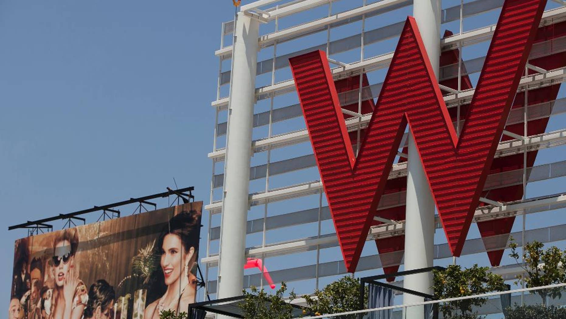 FILE - A Tuesday, July 17, 2012 file photo, shows Starwood Hotels W Hollywood hotel logo in Los Angeles. Starwood Hotels & Resorts Worldwide Inc. reports quarterly earnings on Thursday, April 24, 2014. (AP Photo/Damian Dovarganes, File)