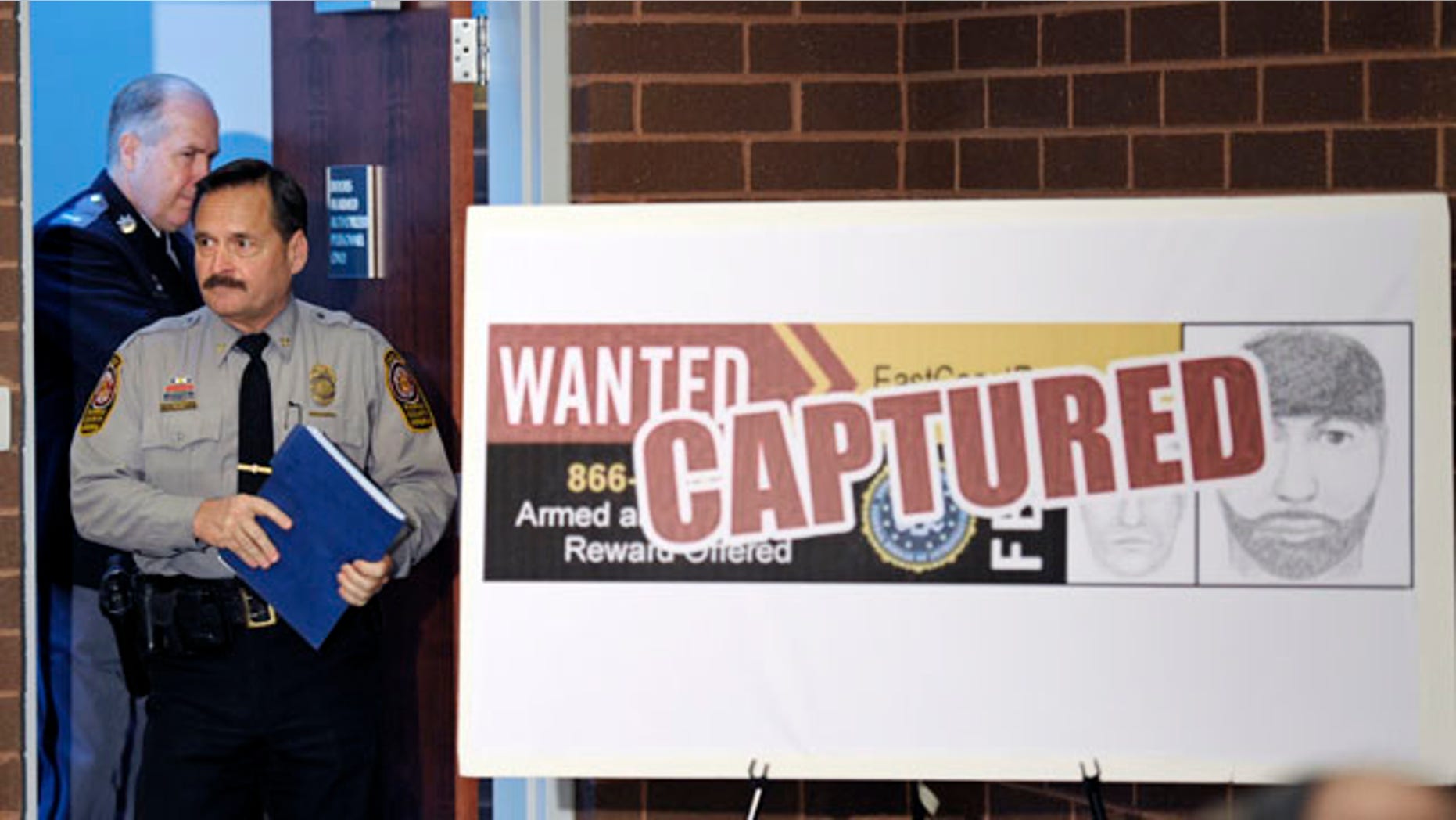 March 7: Fairfax County, Va., Police Chief David Rohrer, followed by Prince William County, Va., Police Chief Charlie Deane, enter the room for a news conference about the arrest of Aaron Thomas, in Manassas, Va. A grand jury has since indicted Thomas, the alleged rapist who faces possible life in prison.