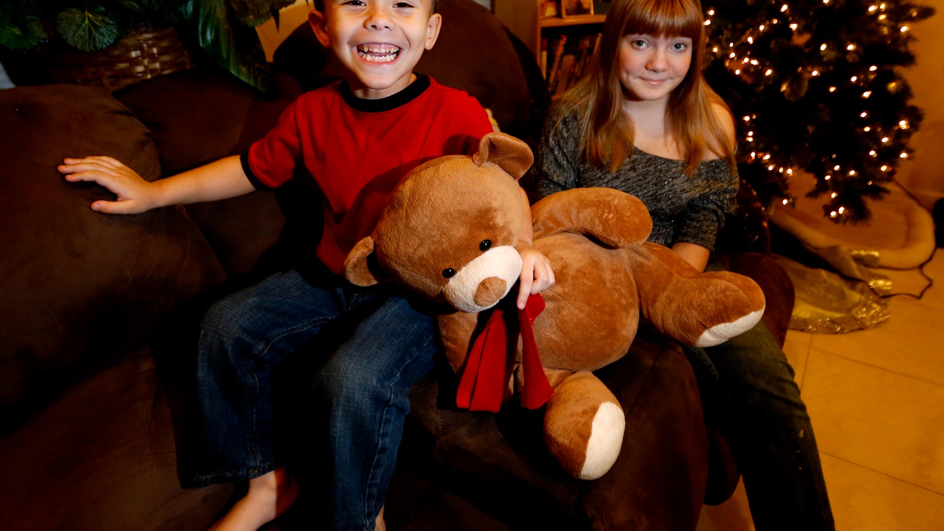 Dec. 6, 2012: McKenna Pope, 13, right, and her brother Gavyn Boscio, 4, pose for a photo at their home in Garfield, N.J.