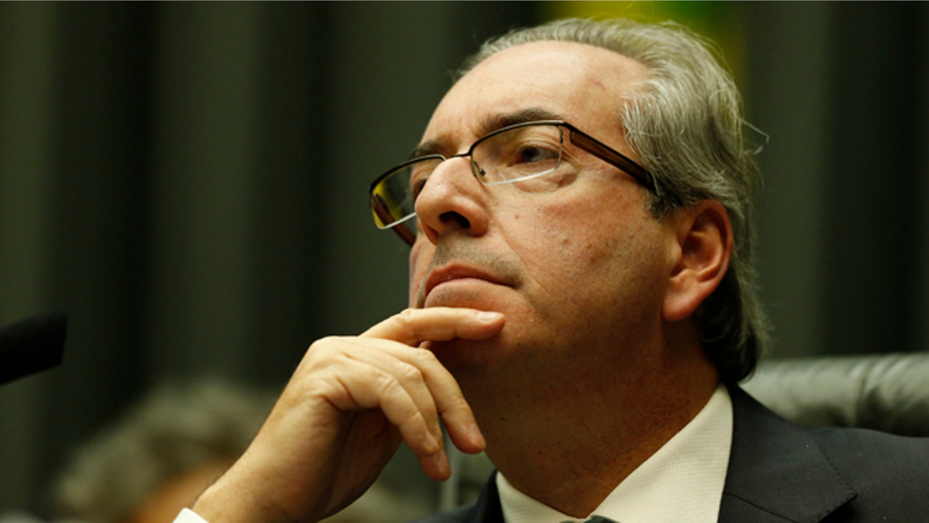 BRASILIA, BRAZIL - MARCH 17: Eduardo Cunha, Speaker of the house, addresses the plenary during a special session of legislators negotiating the nomination of memberson of the committee that will initiate the impeachment process of President DIlma Rousseff on March 17, 2016 in Brasilia, Brazil. His controversial cabinet appointment comes in the wake of a massive corruption scandal and economic recession in Brazil. (Photo by Igo Estrela/Getty Images)
