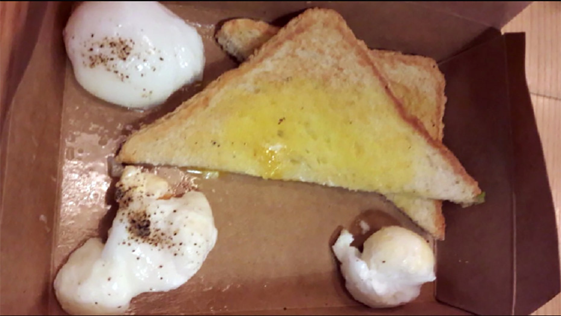 Social media users were appalled after a British vacationer shared a snap of his “horrific” eggs on toast airport breakfast.