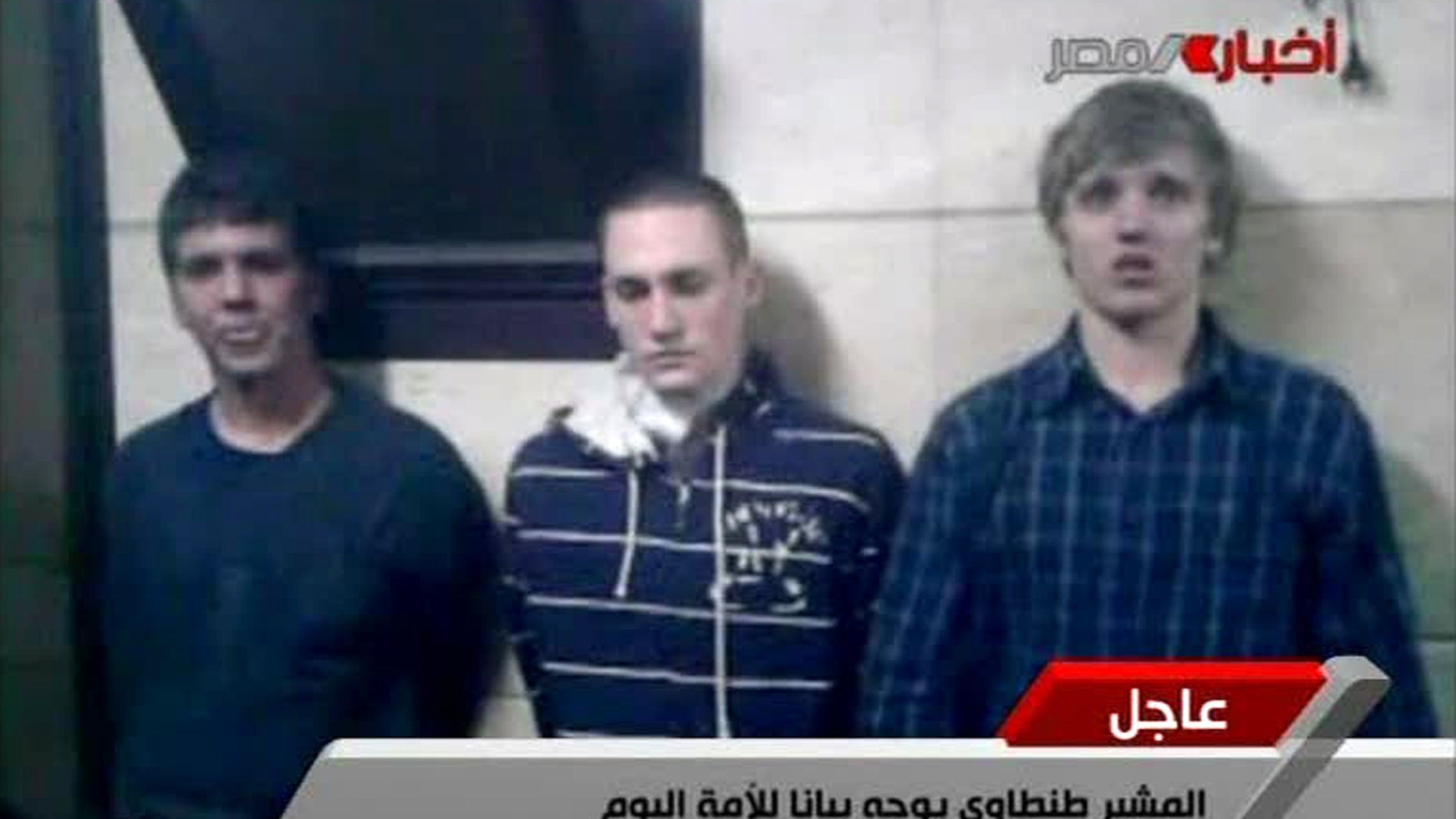 Nov 22 2011: Three American students are displayed to the camera by Egyptian authorities following their arrest during protests in Cairo, where an Egyptian official said they were throwing firebombs at security forces.