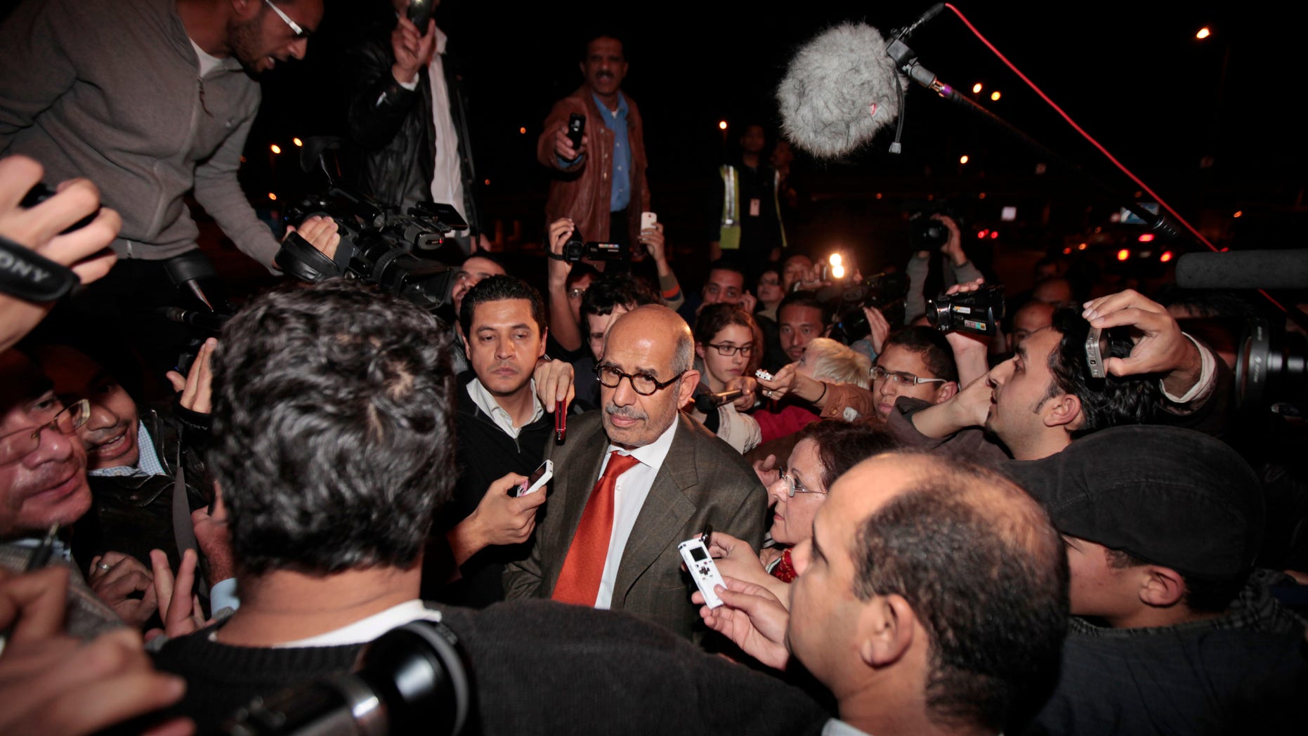 Jan. 27, 2011: Former Director General of the International Atomic Energy Agency, IAEA, and Nobel Peace Prize winner Mohamed ElBaradei talks to members of the media as he arrives at Cairo's airport in Egypt, from Austria. ElBaradei told reporters that the regime has not been listening. He urged the Egyptian regime to exercise restraint with protesters, saying they have been met with a good deal of violence which could lead to an explosive situation. (AP)