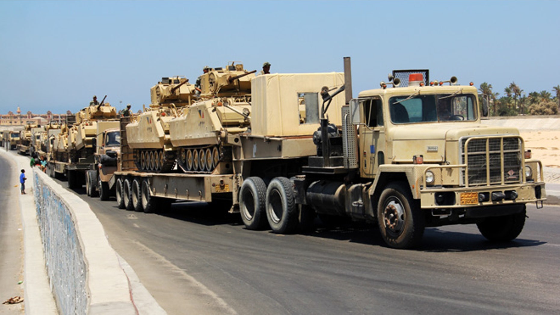 Aug. 9. 2012: In this file photo, army trucks carry Egyptian military tanks in El Arish, Egypt's northern Sinai Peninsula.