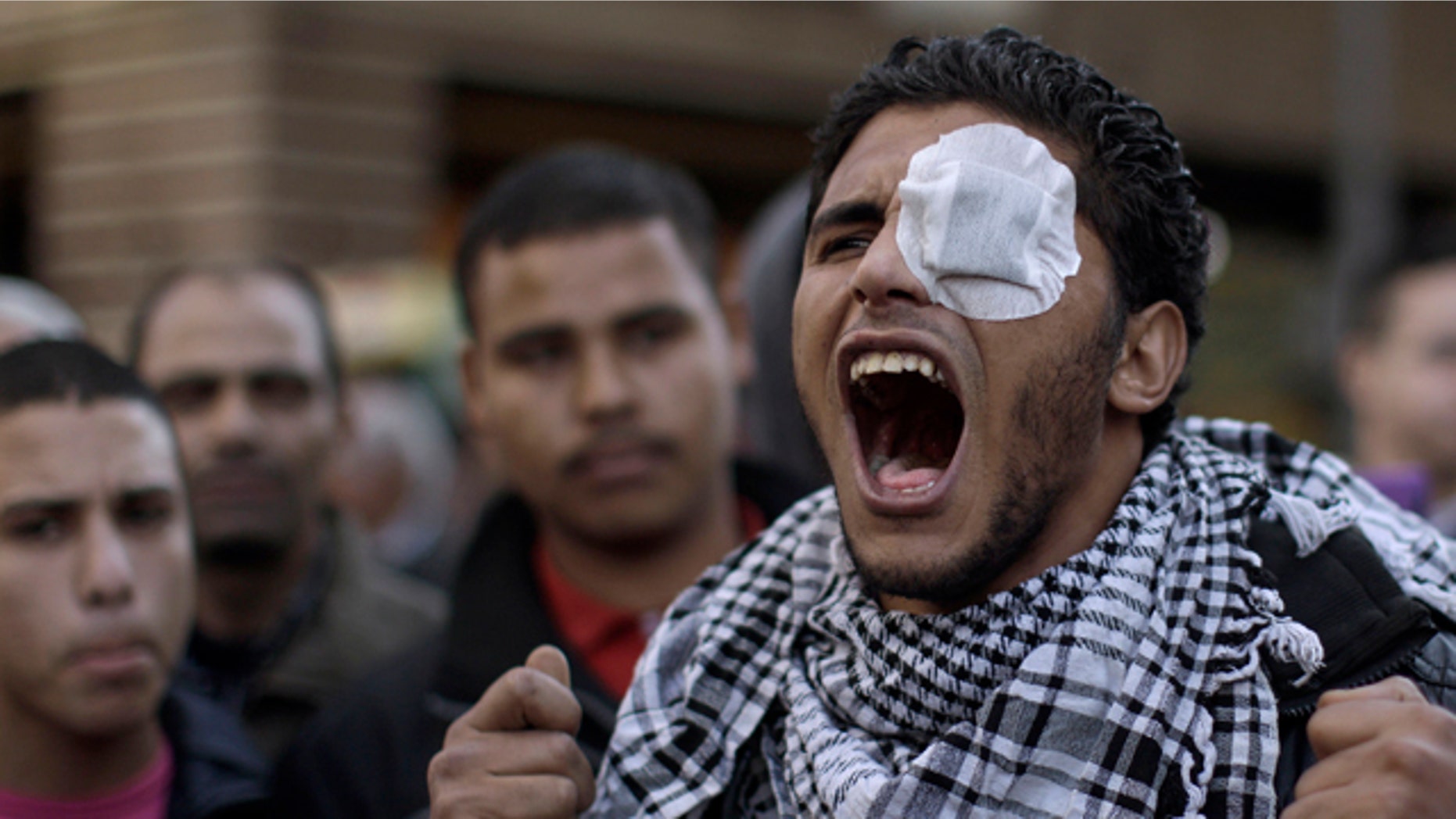 Jan. 31: An Egyptian protestor shouts slogans during a rally outside the Parliament in Cairo.
