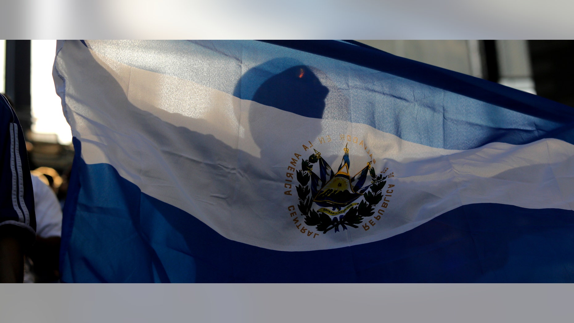 KANSAS CITY, KS - MARCH 31: An El Salvador fan waves a flag during a game against Honduras in the first half of the 2012 CONCACAF Men's Olympic Qualifying Semifinals at Livestrong Sporting Park on March 31, 2012 in Kansas City, Kansas. (Photo by Ed Zurga/Getty Images)
