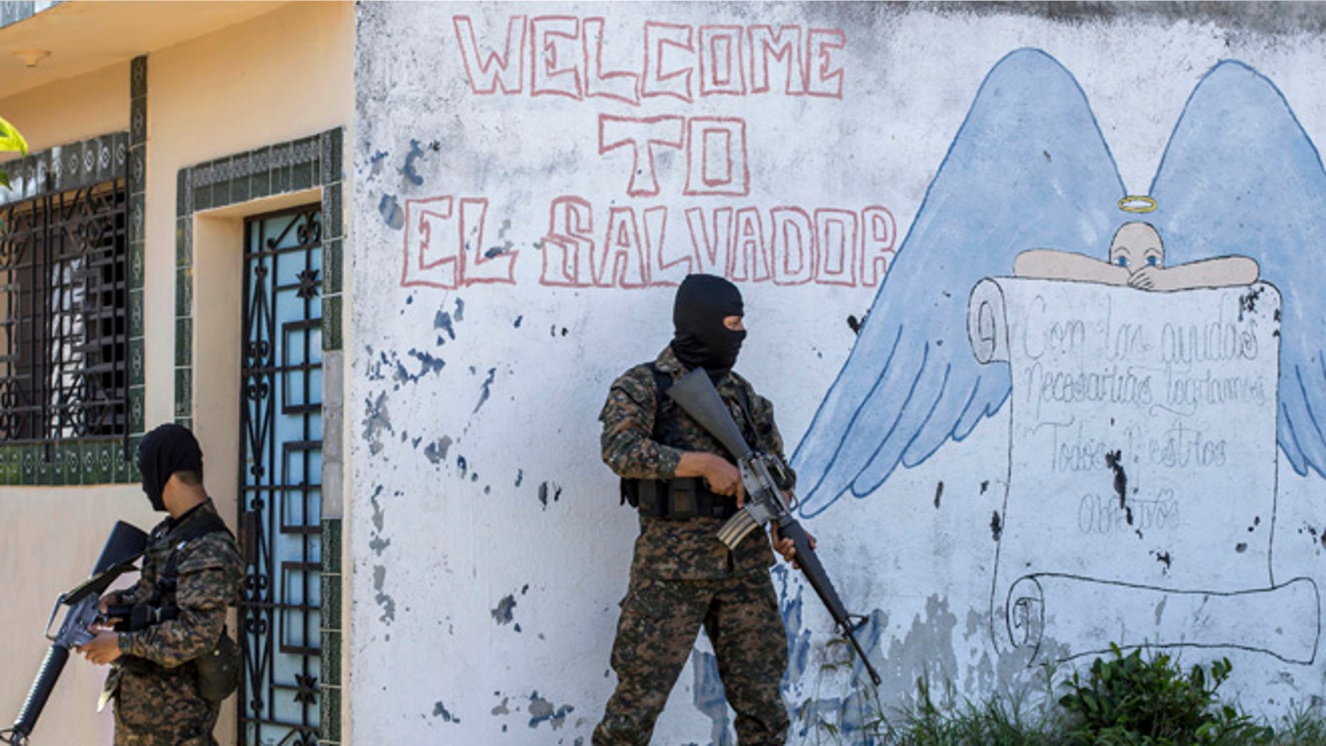 FILE - In this Aug. 31, 2015 file photo, soldiers guard a corner in a gang-controlled neighborhood in Ilopango, El Salvador. A video broadcast by local media on Saturday, March 26, 2016, purportedly made by the countryâs main street gangs, is offering an end to killings, and asks the government not to continue an anti-gang offensive. Officials said they would not negotiate with the gangs. (AP Photo/Salvador Melendez, File)