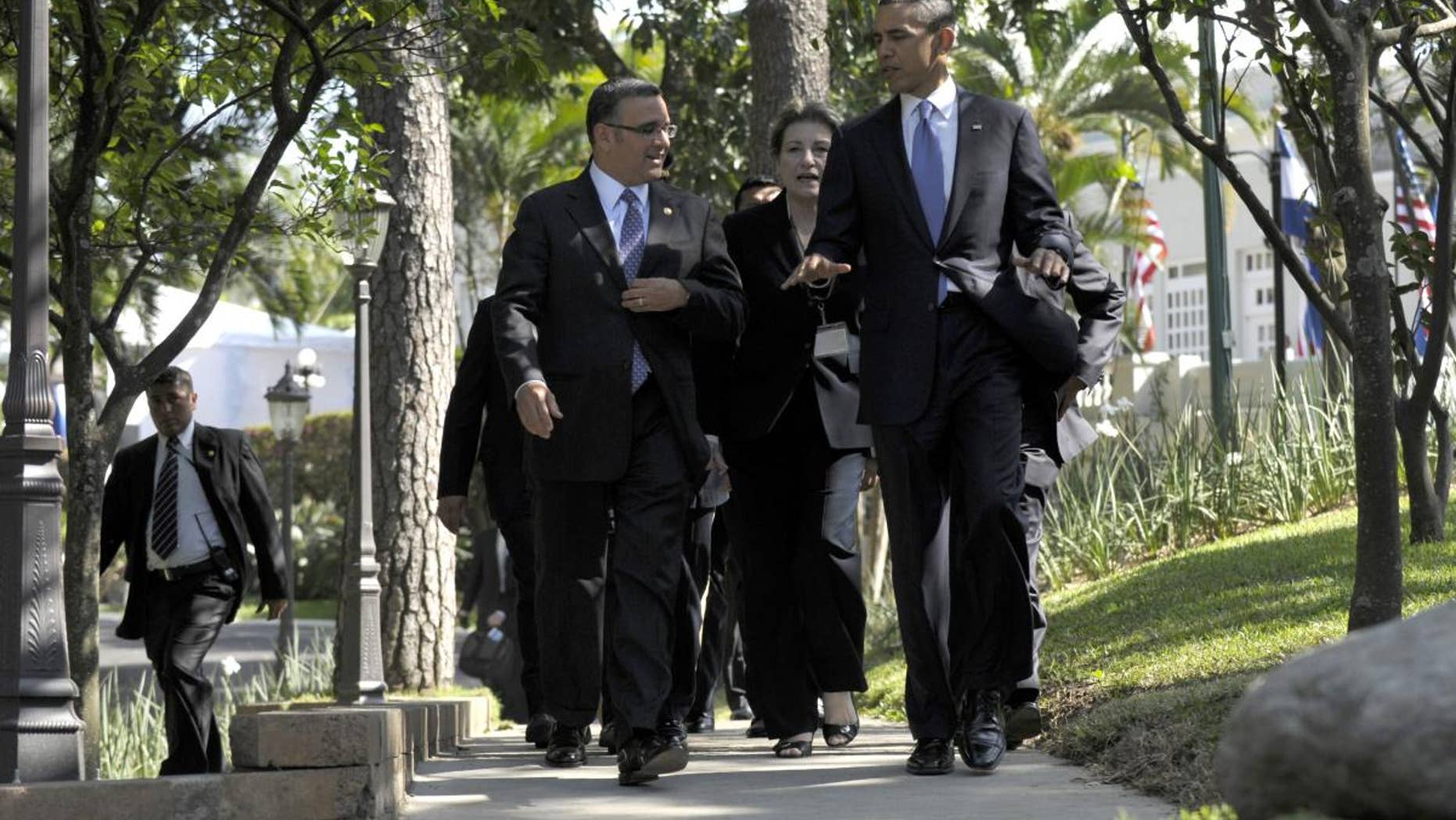 President Barack Obama and President of El Salvador President Mauricio Funes walk to a joint press conference at the Casa Presidential in San Salvador, El Salvador, Tuesday, March 22, 2011. (AP Photo/Susan Walsh)