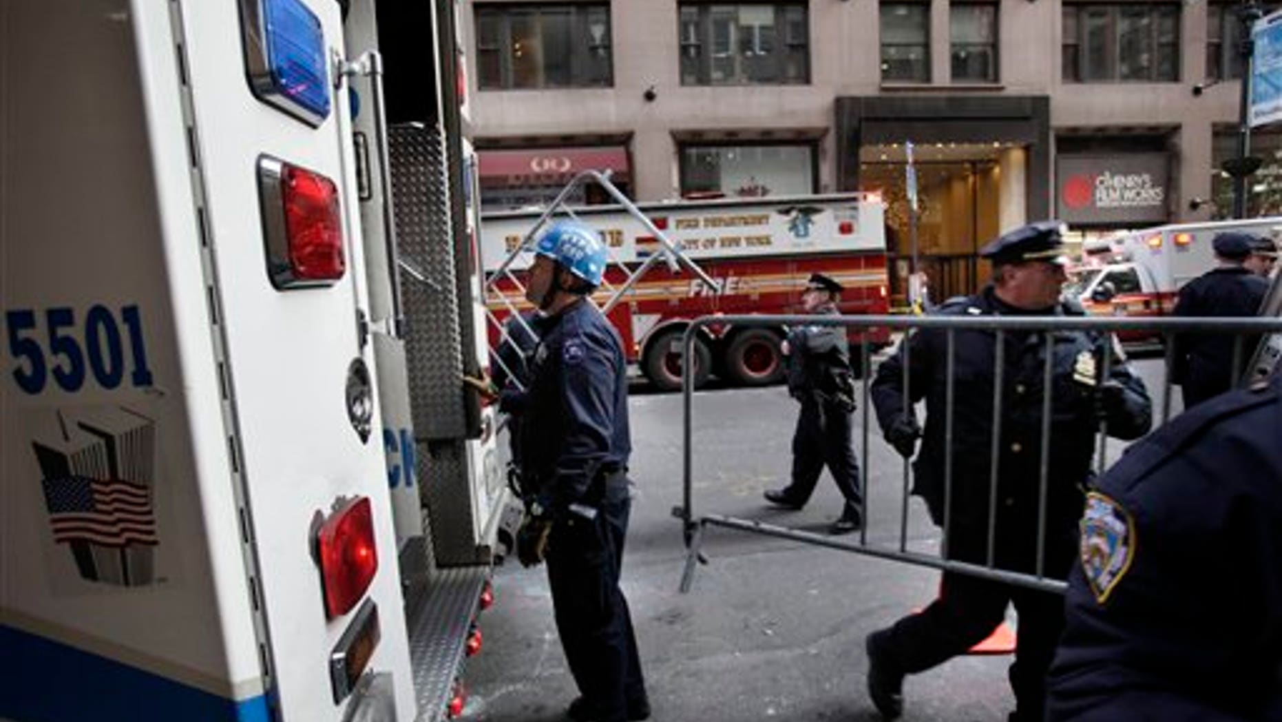 Dec. 14: Emergency personnel gather outside of a building where there was an elevator accident in New York. A woman was killed when her foot or leg became caught in an elevator's closing doors, New York City fire officials said Wednesday.