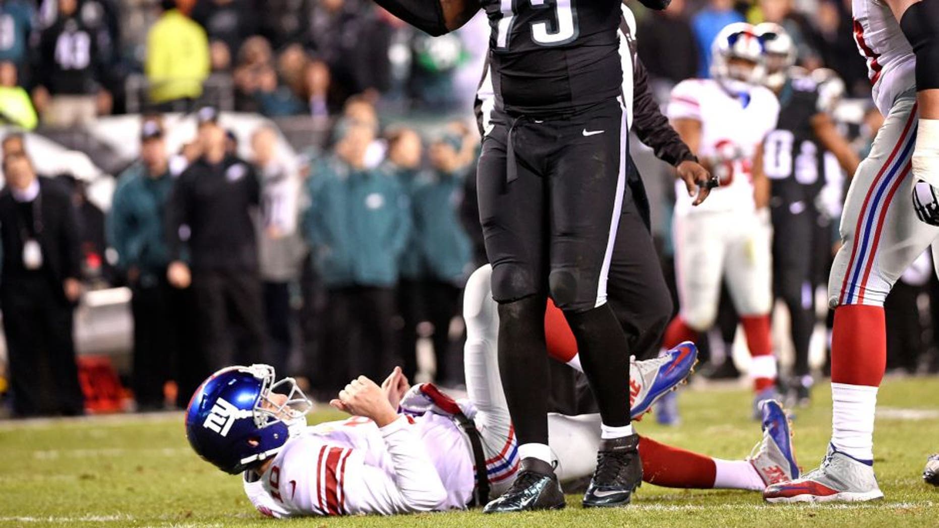 Oct 19, 2015; Philadelphia, PA, USA; Philadelphia Eagles defensive end Vinny Curry (75) reacts after pressuring New York Giants quarterback Eli Manning (10) into intentional grounding during the fourth quarter at Lincoln Financial Field. The Eagles defeated the Giants, 27-7. Mandatory Credit: Eric Hartline-USA TODAY Sports