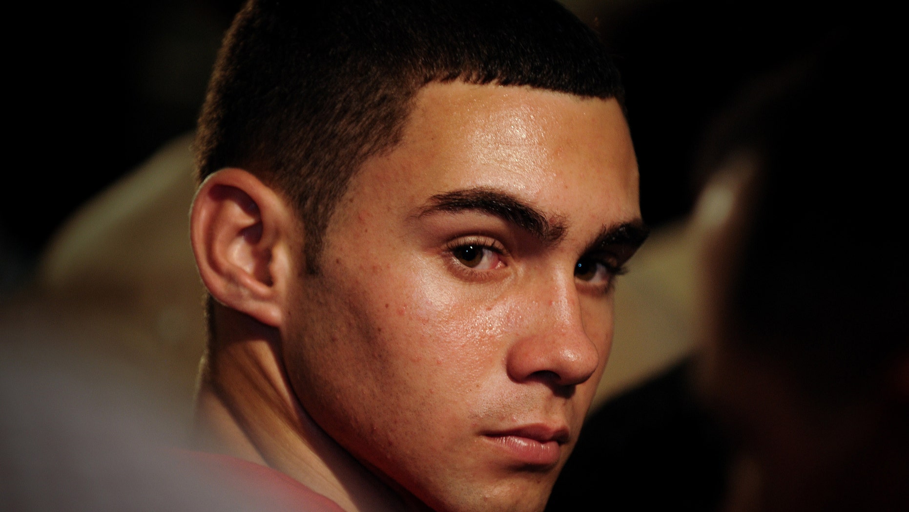 FILE - In this June 30, 2010 file photo, Elian Gonzalez attends an official event with Cuba's President Raul Castro in Havana, Cuba. The young Cuban raft boy who was the subject of a high-profile international custody dispute more than a decade ago, turned 20 on Friday, Dec. 6, 2013. Cuban state media report that Gonzalez is in Ecuador as part of a delegation of the World Festival of Youth and Students, his first trip overseas trip since he was reunited with his father in 2000. (AP Photo/Adalberto Roque, File Pool)
