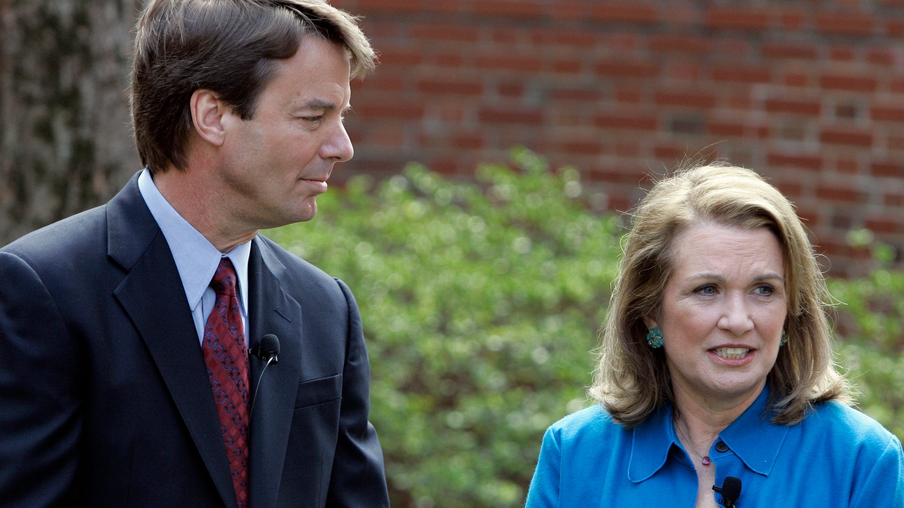 In this March 2007 file photo, Democratic Presidential hopeful John Edwards, left, listens to his then-wife Elizabeth speak about her recurrence of cancer during a news conference in Chapel Hill, N.C. John Edwards reportedly has proposed to his mistress, barely three weeks after his wife Elizabeth's death.