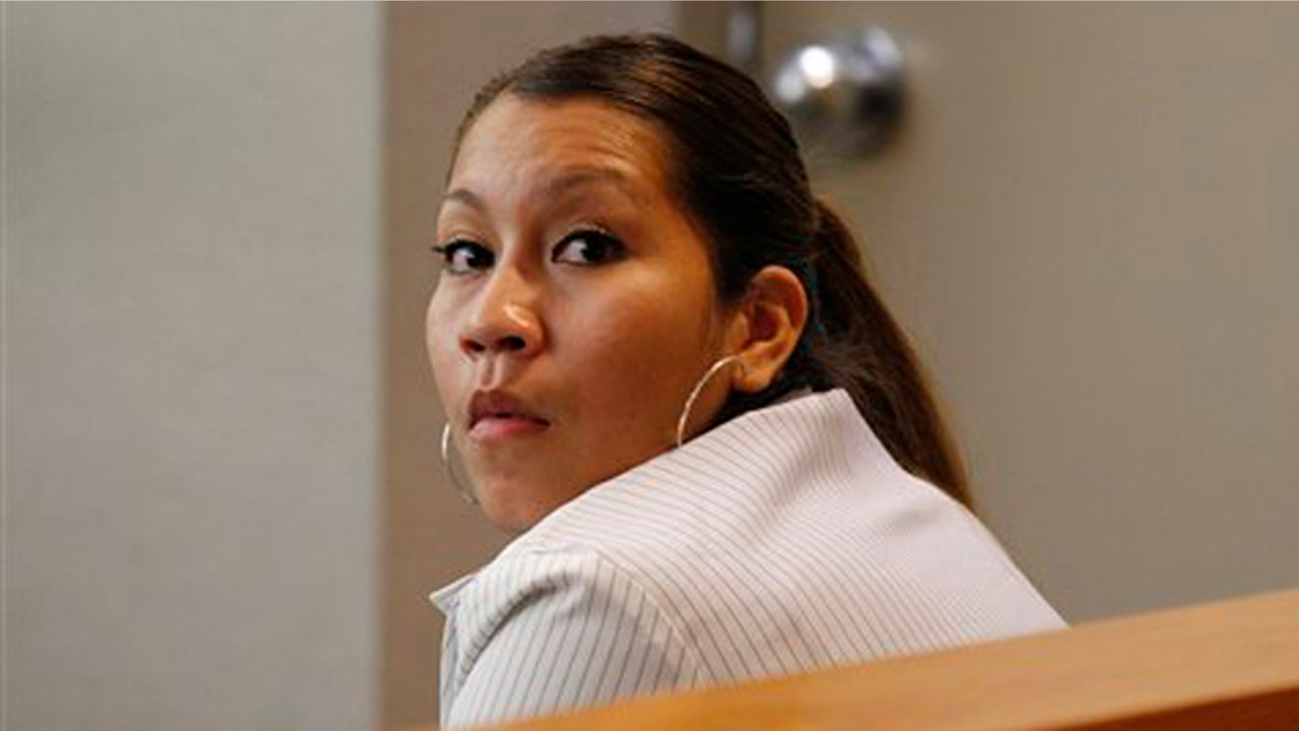 Elizabeth Escalona, 23, sits in a courtroom to be sentenced, in Dallas, Monday, Oct. 8, 2012.