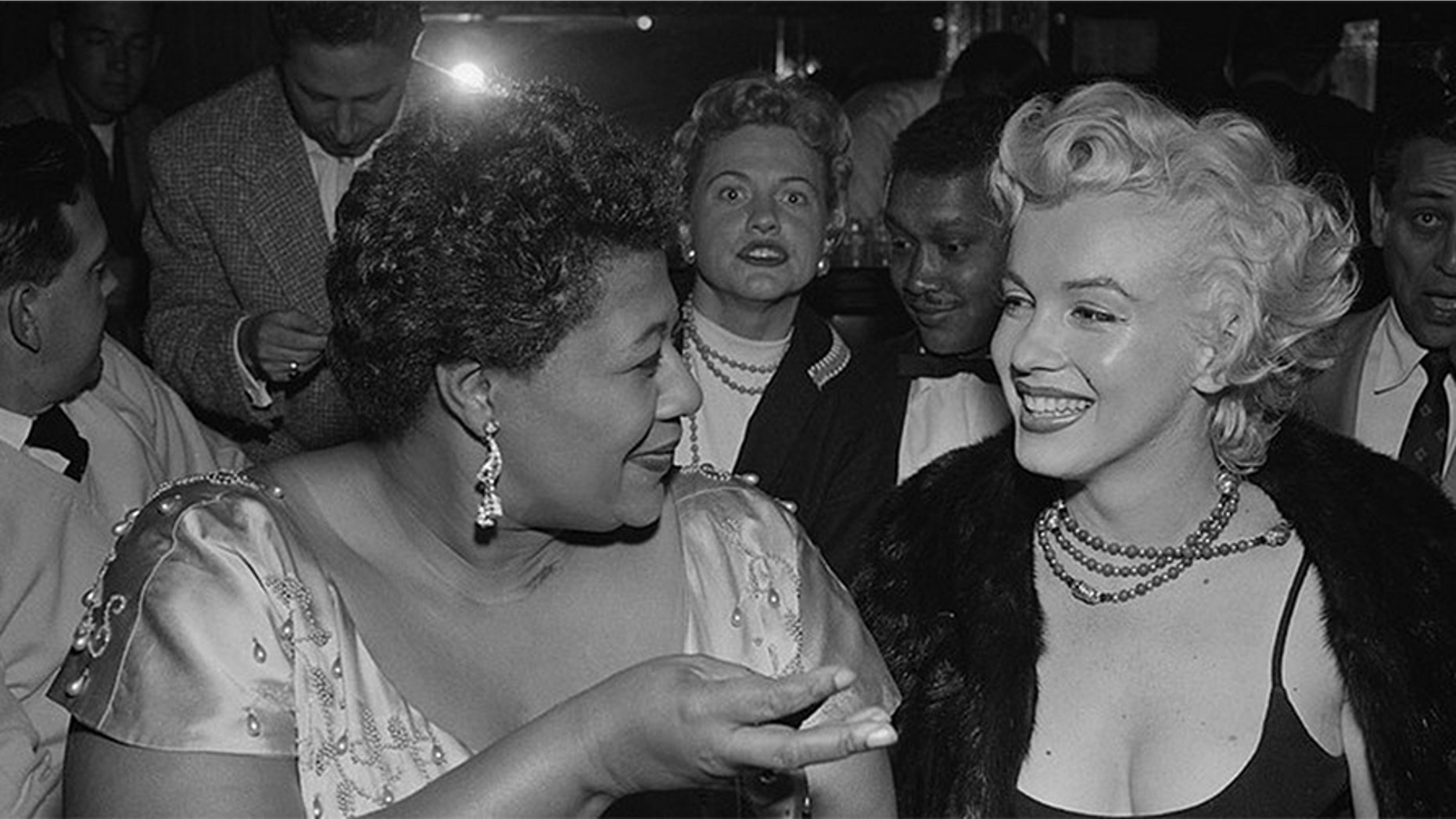 Ella Fitzgerald with Marilyn Monroe.